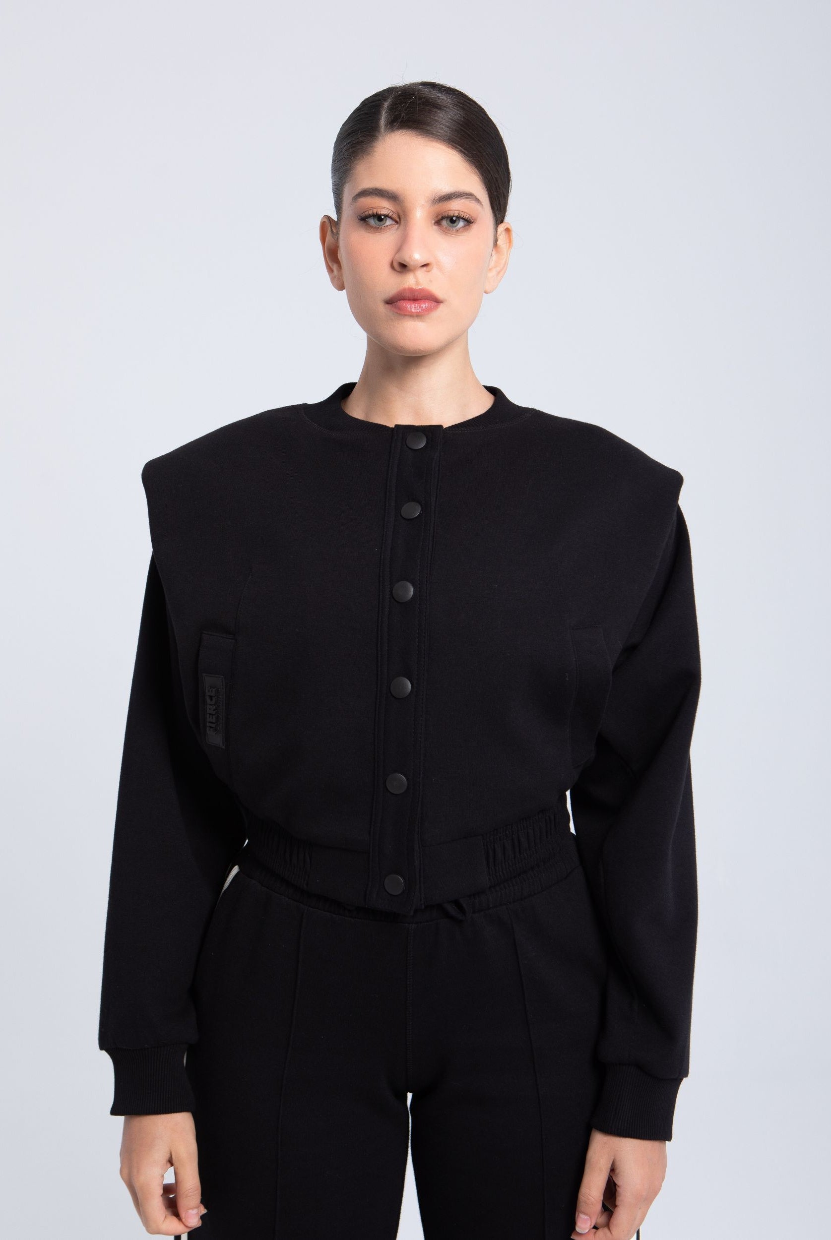 Elite snap-front structure jacket black front view with structured shoulders