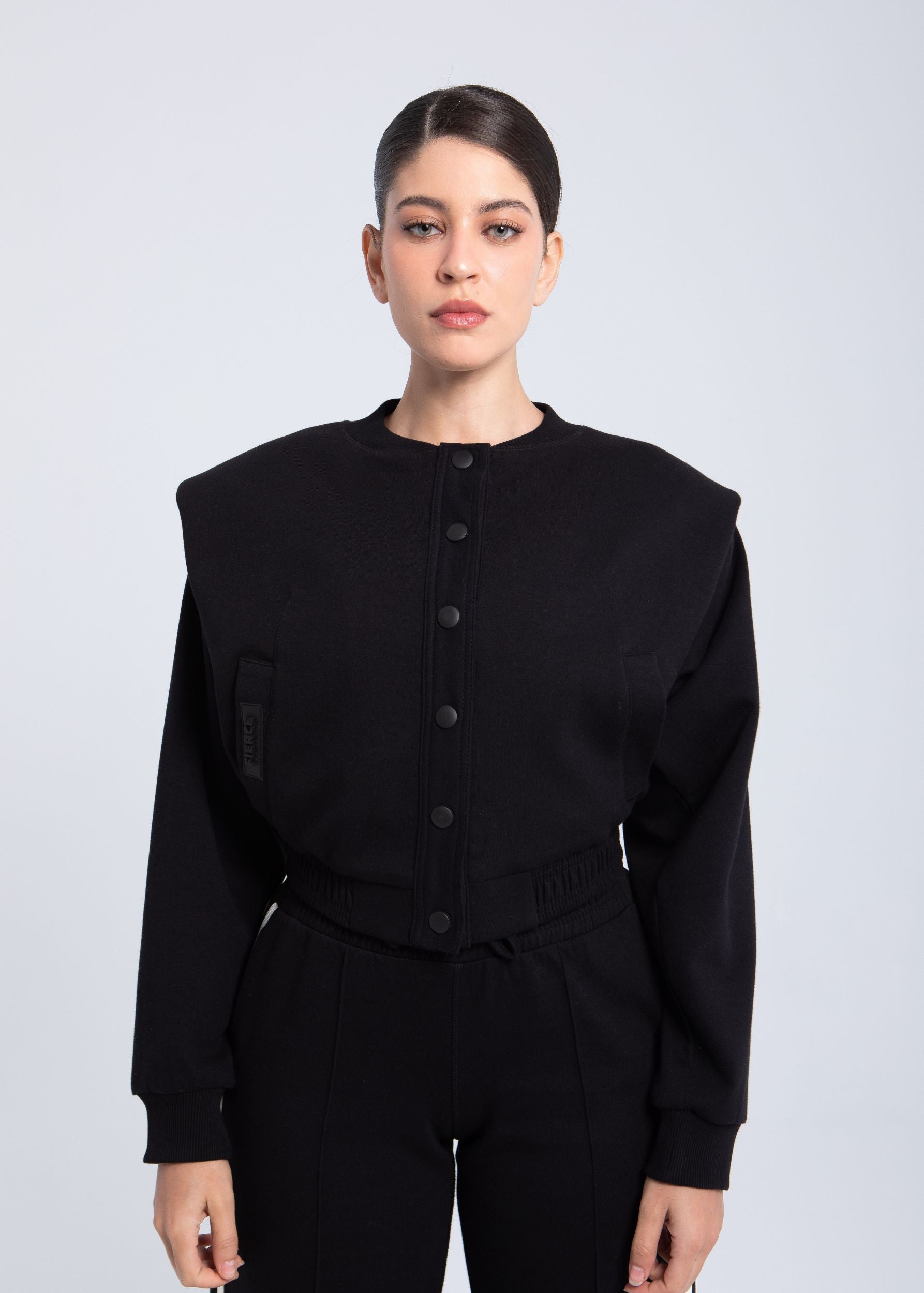 Elite snap-front structure jacket black front view with structured shoulders