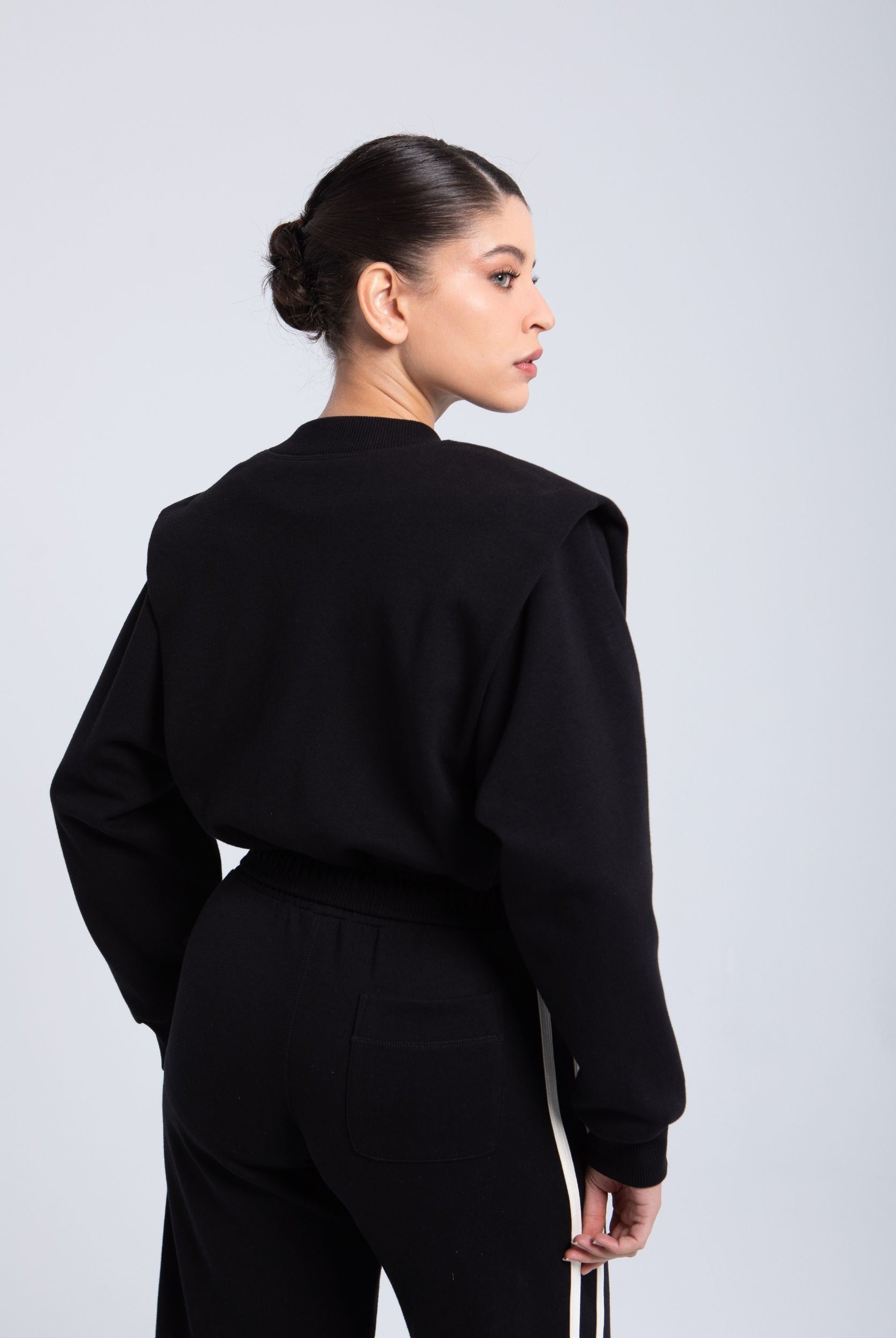 Elite snap-front structure jacket black back view clean silhouette