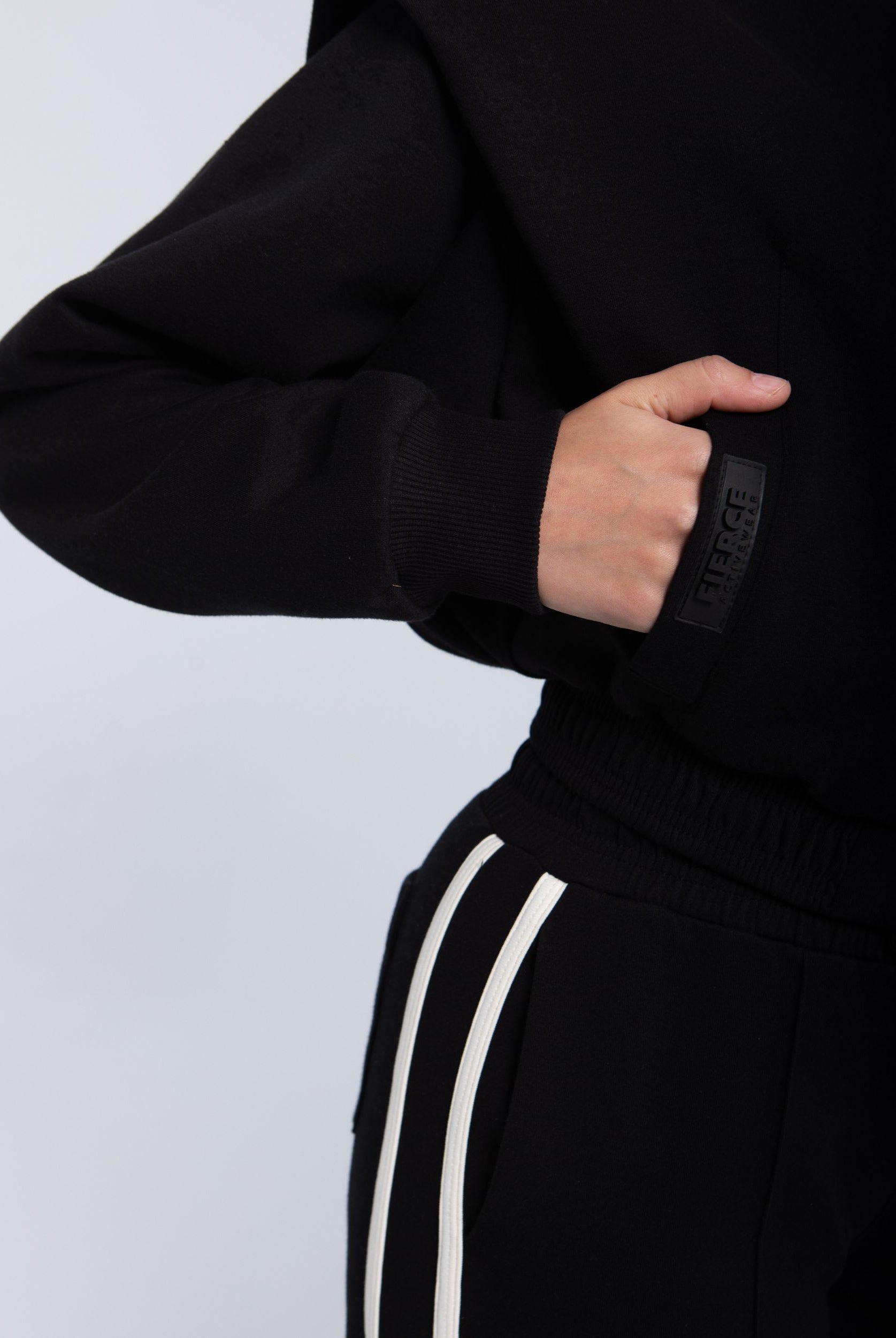 Elite snap-front structure jacket black close-up snap buttons and ribbed cuff