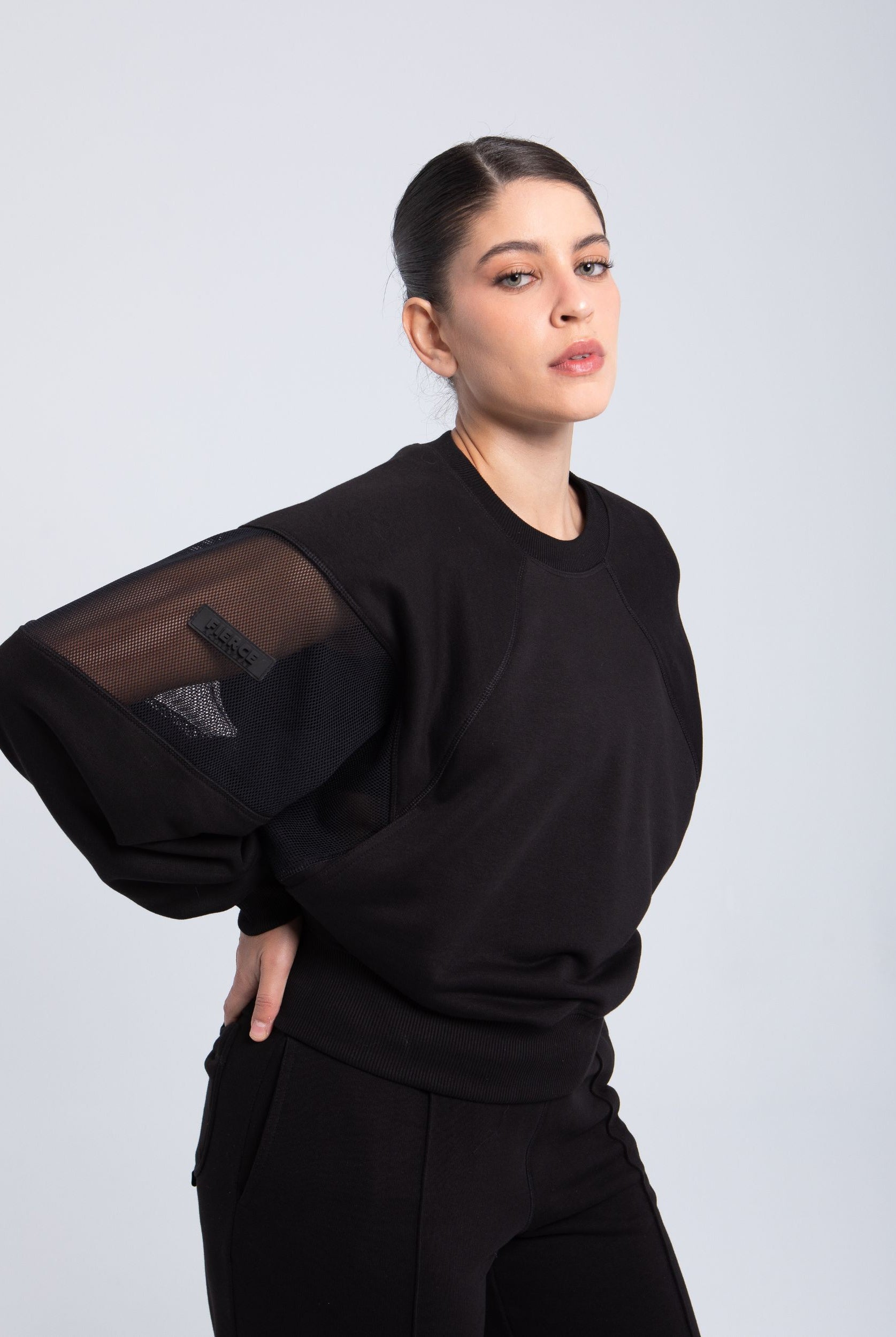 Black oversized sweatshirt with mesh sleeve detail