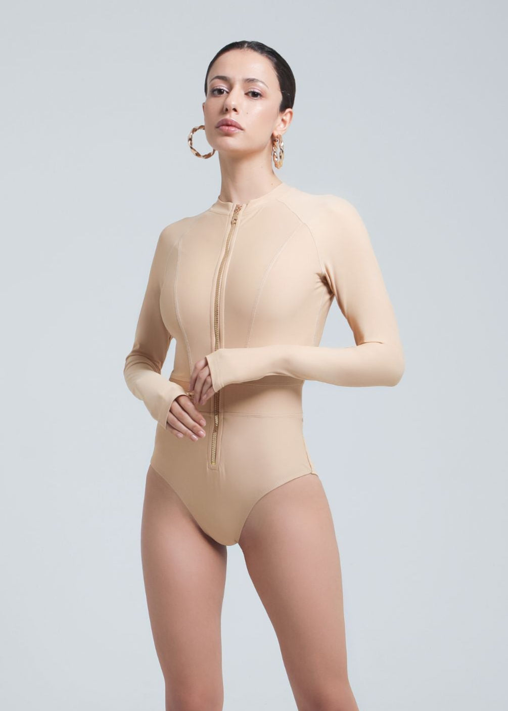 UV-protected one-piece swimwear with thumb holes and sleek design