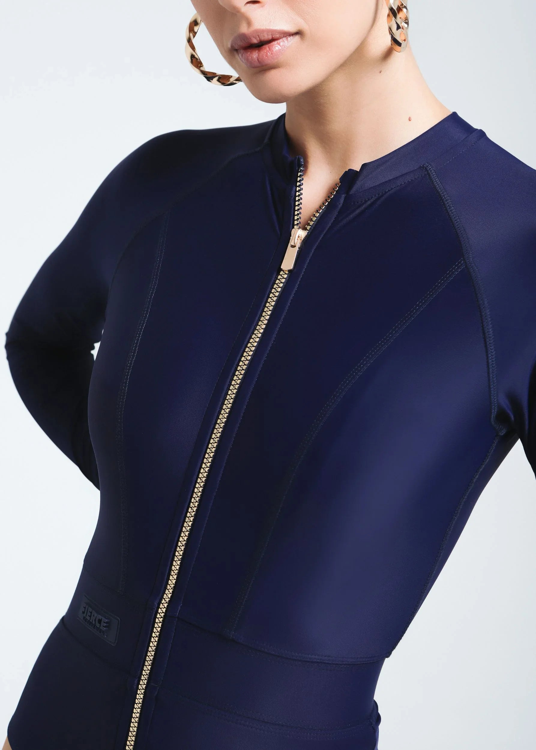 UV-protected one-piece swimwear with thumb holes and sleek design