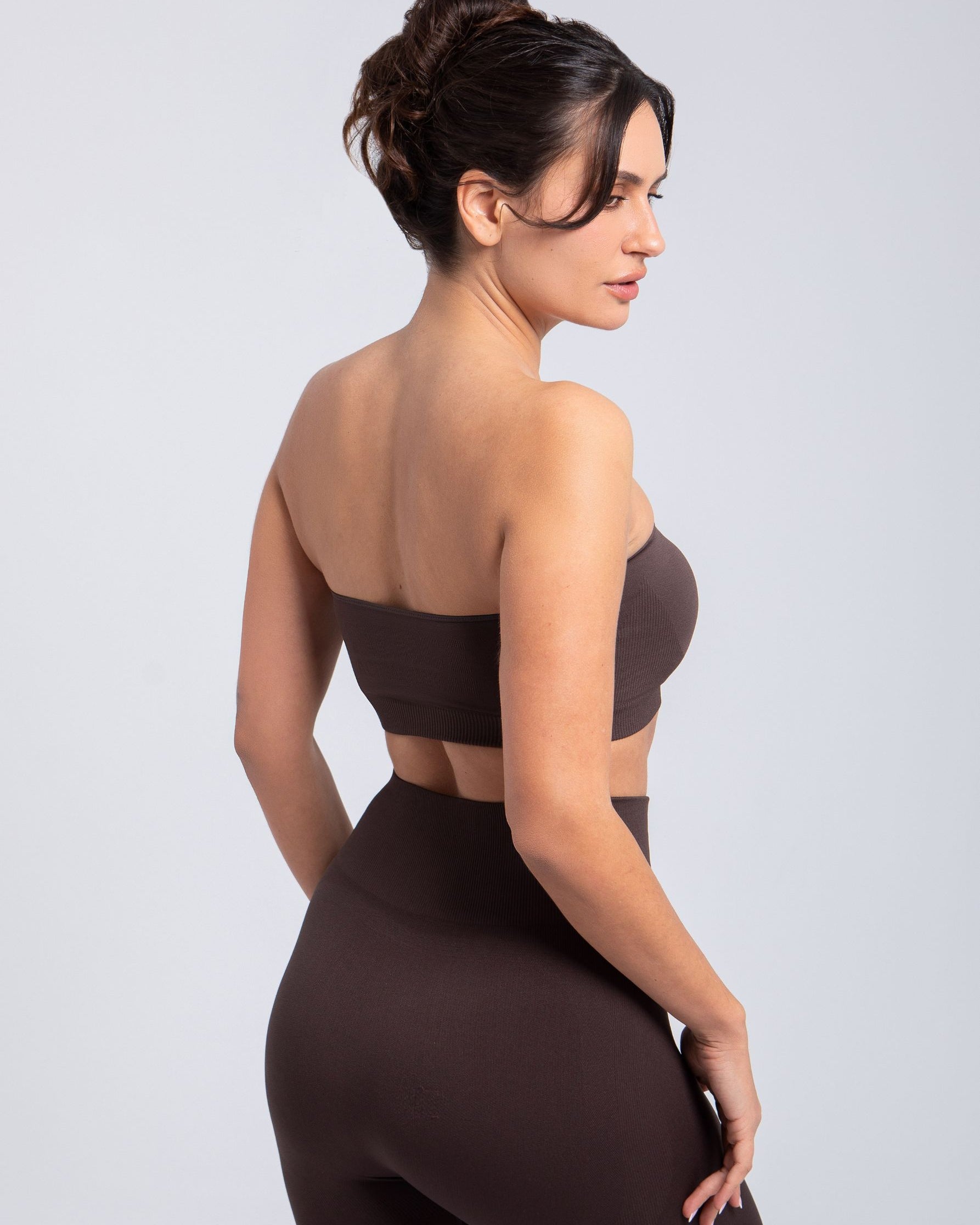 Model standing in Espresso sculpt push-up bandeau bra three-quarter front view