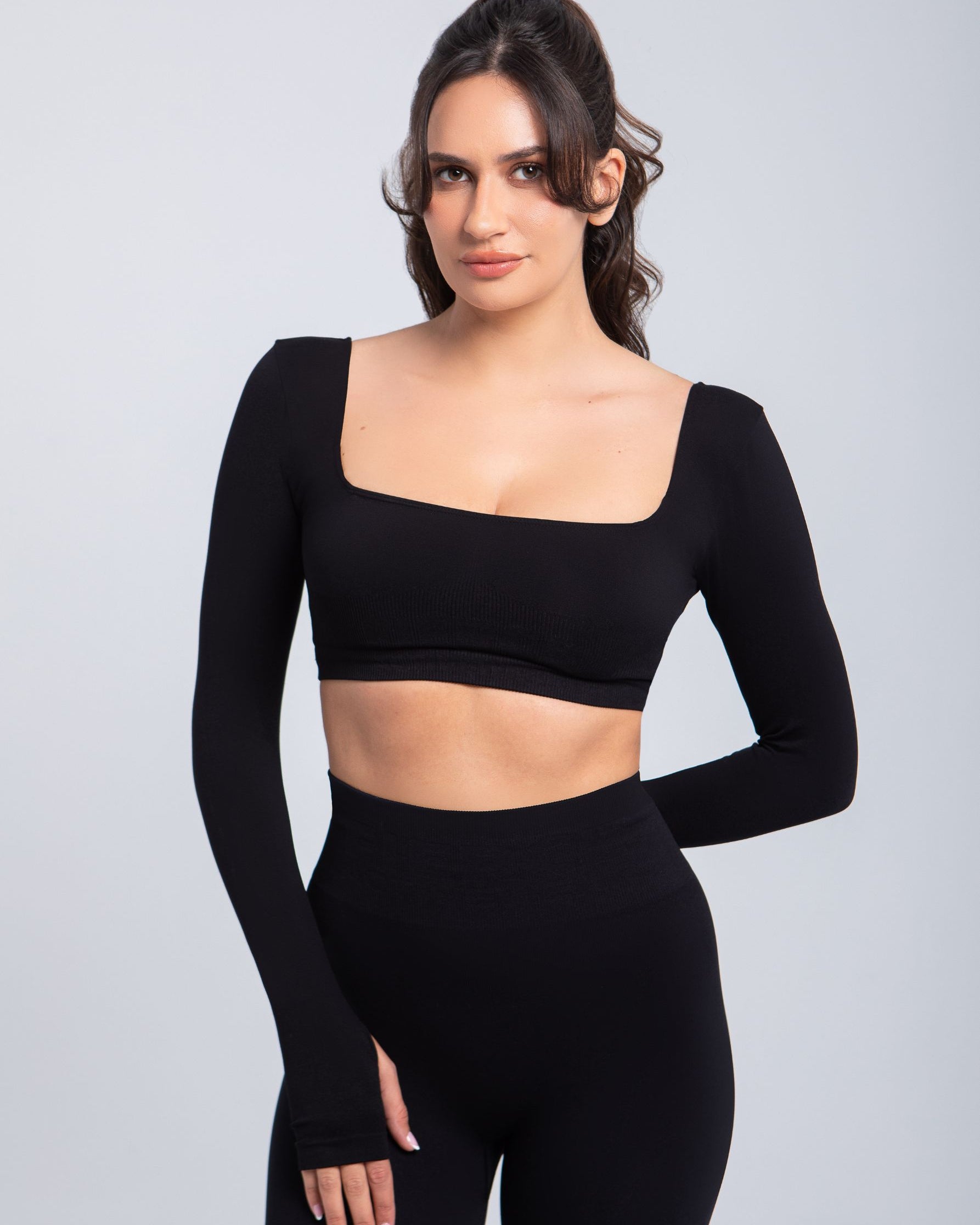 Front portrait of Second Skin sculpt push-up long sleeve bra in Black emphasizing neckline and support structure