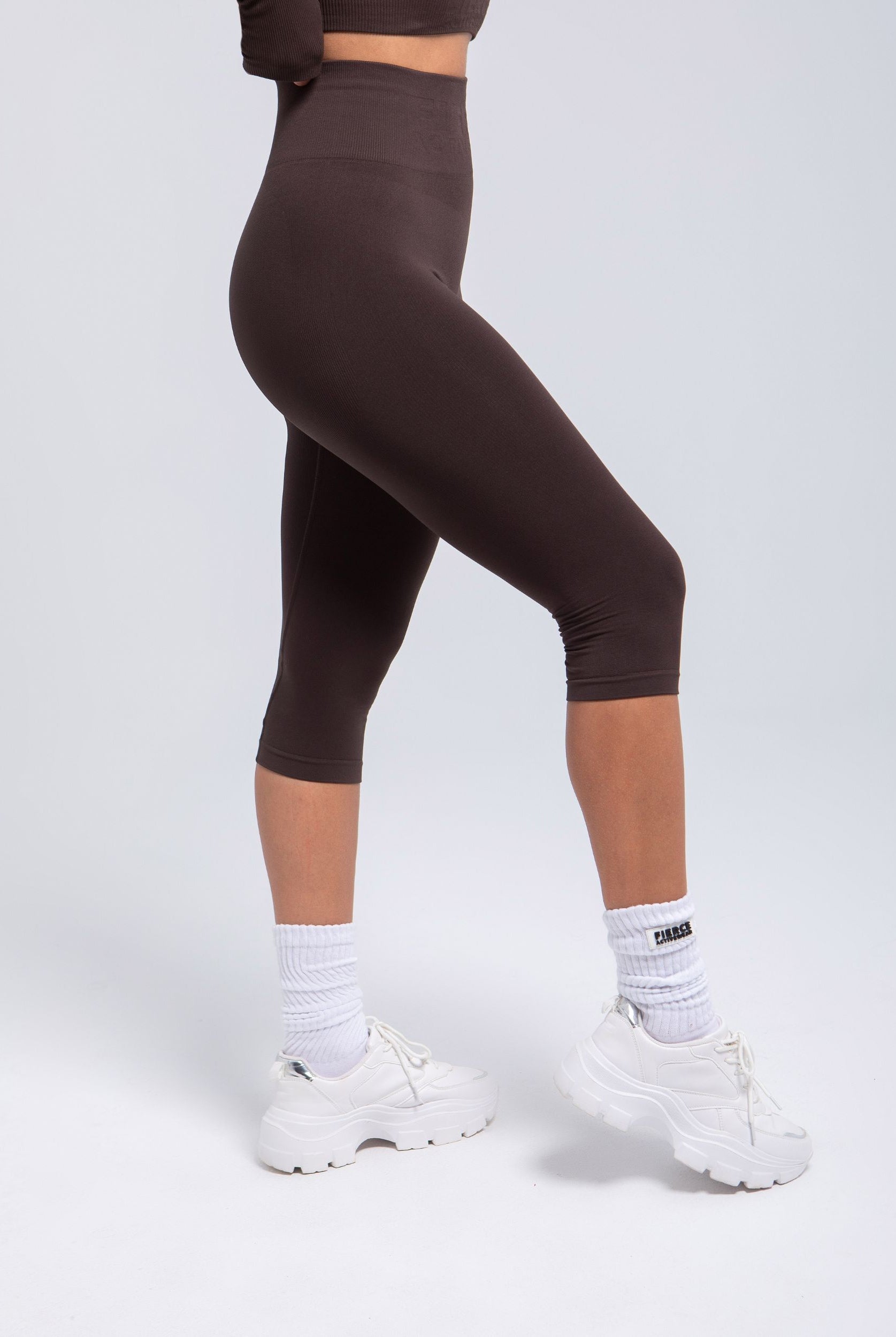 Espresso Second Skin capri leggings side view showing seamless fit and high rise