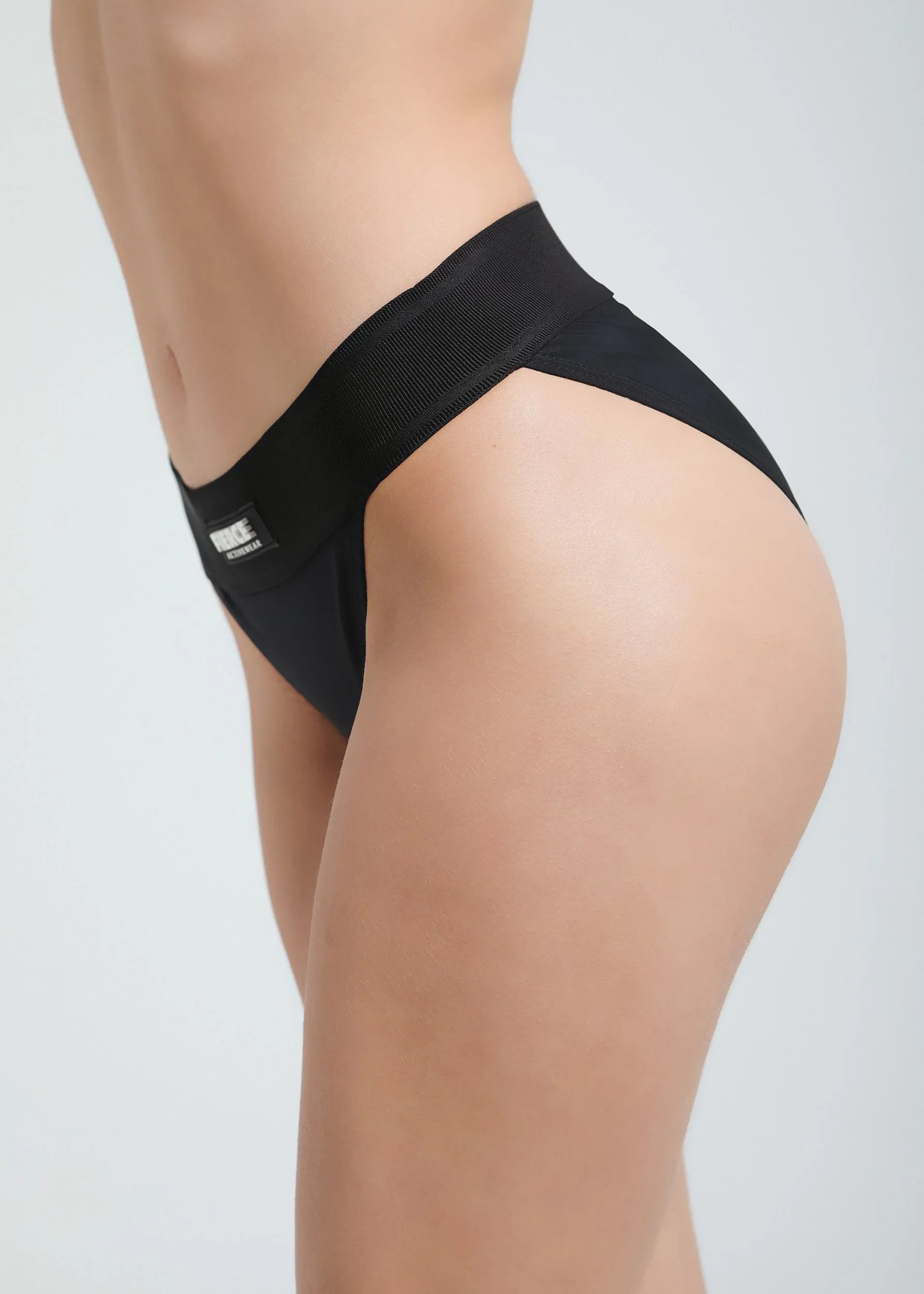 Serena low-waist bikini bottoms with bold elastic band and sleek fit