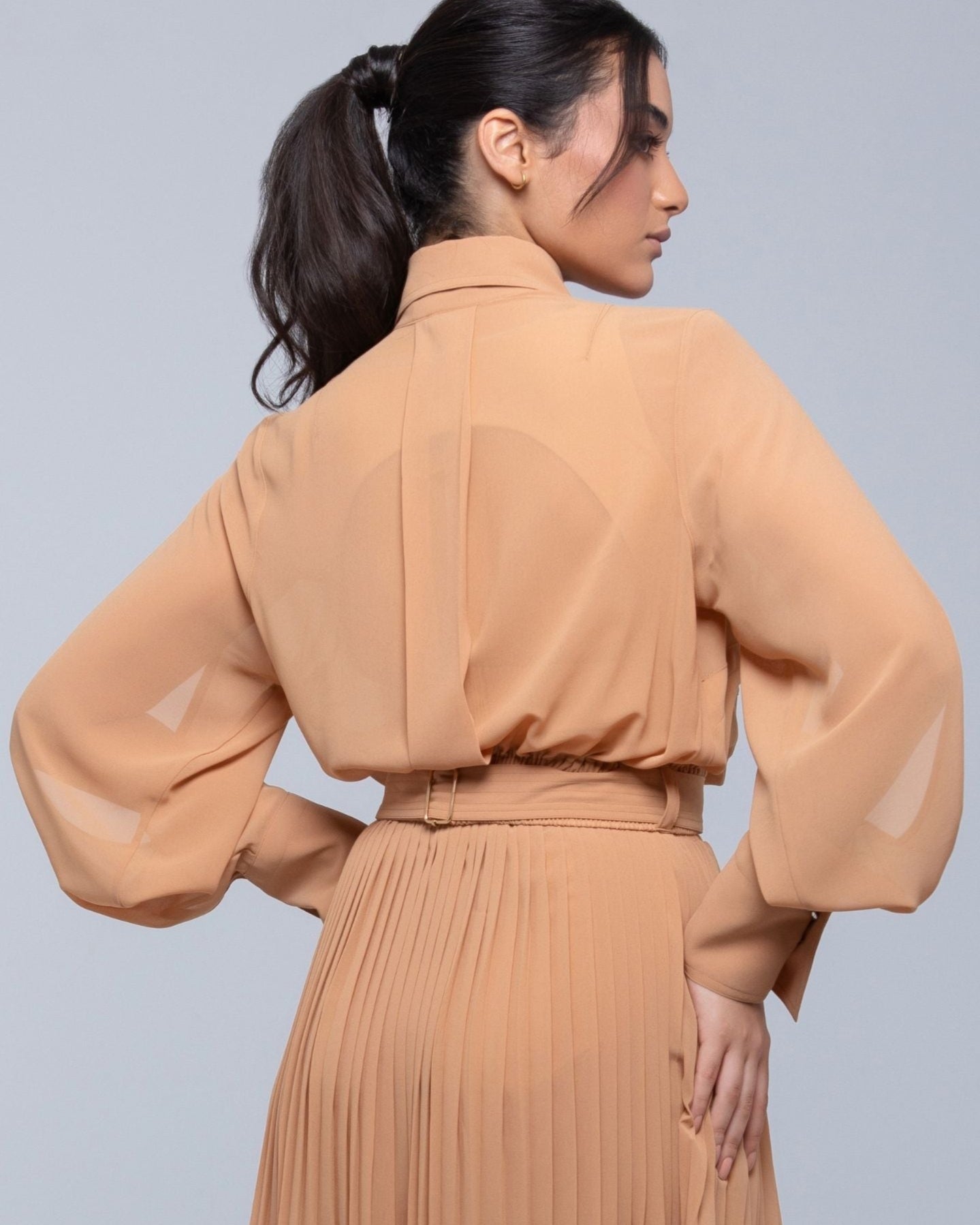 Sheer Jacket with button front, sleeve slits, and gold-accented belt