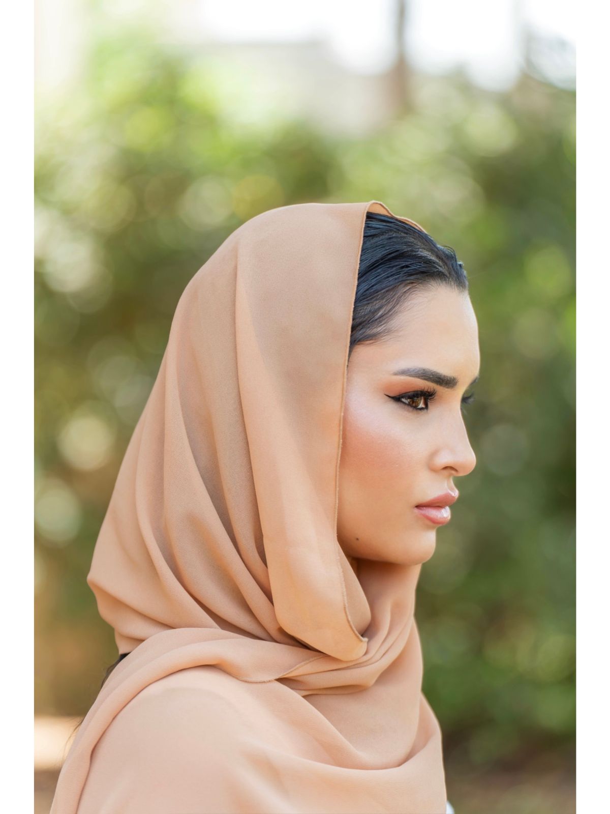 Sheer Maxi Shirt with gold-accented belt and adjustable sleeves