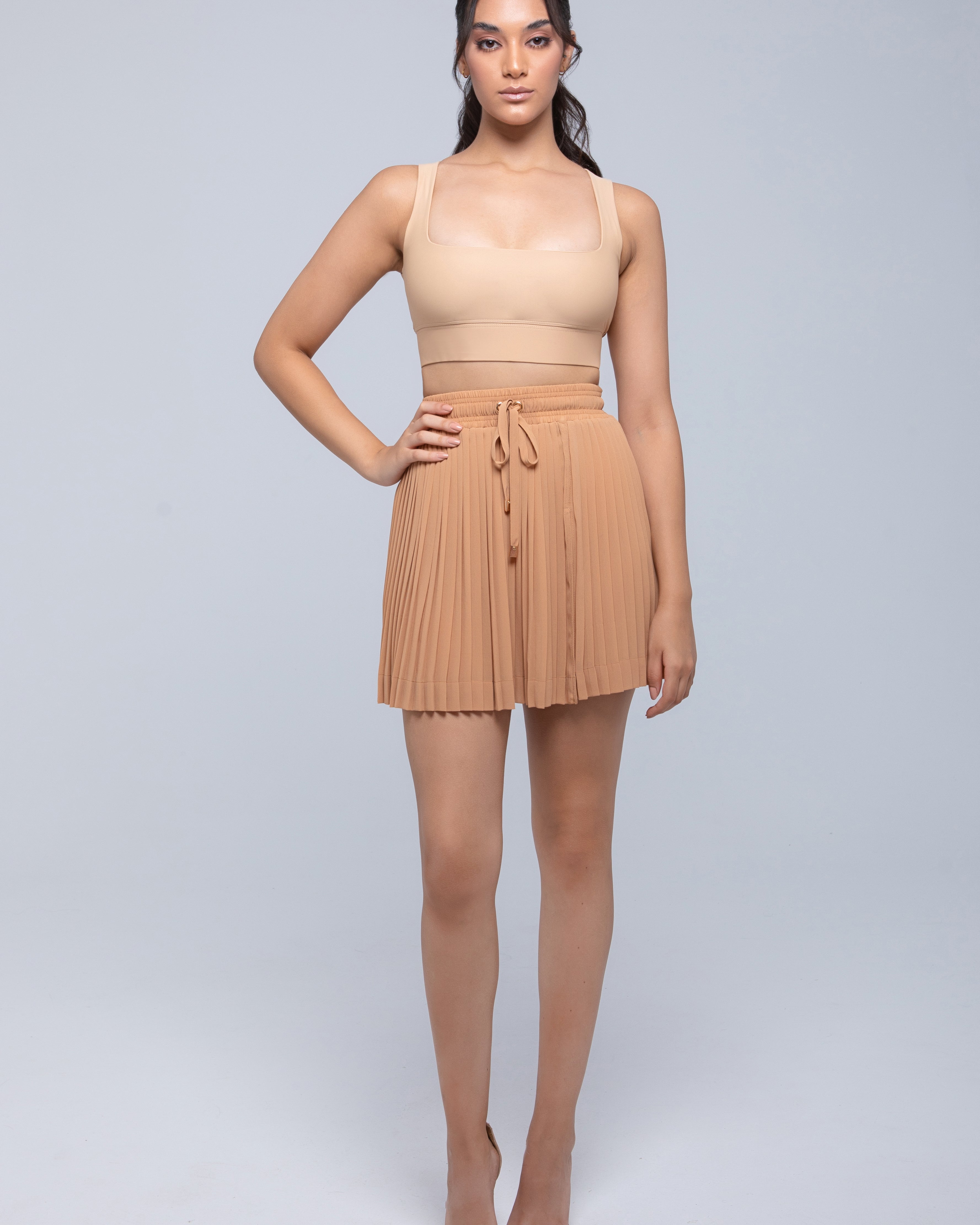 Sheer mini skirt with pleated lightweight fabric and one-side slit