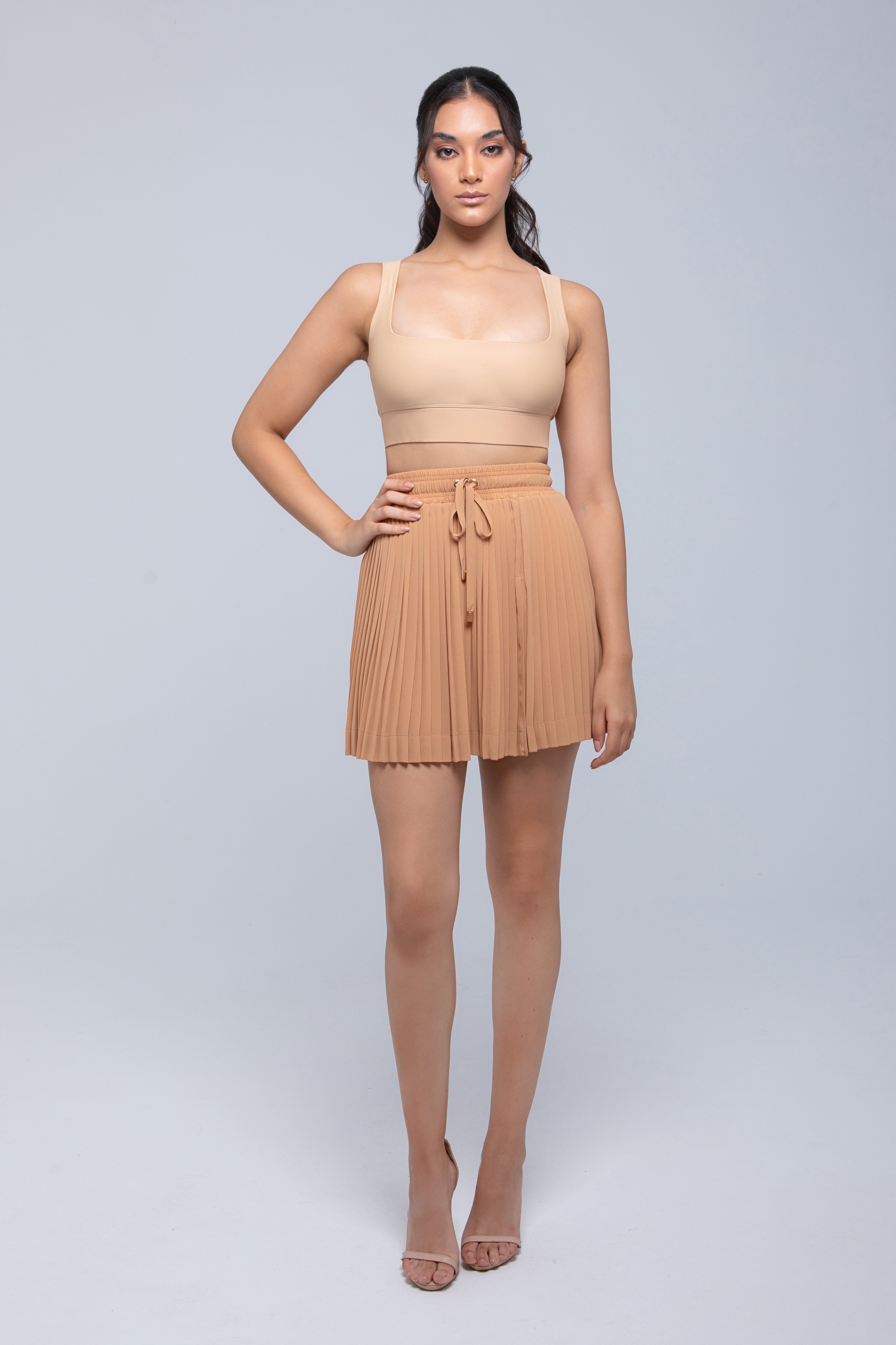 Sheer mini skirt with pleated lightweight fabric and one-side slit