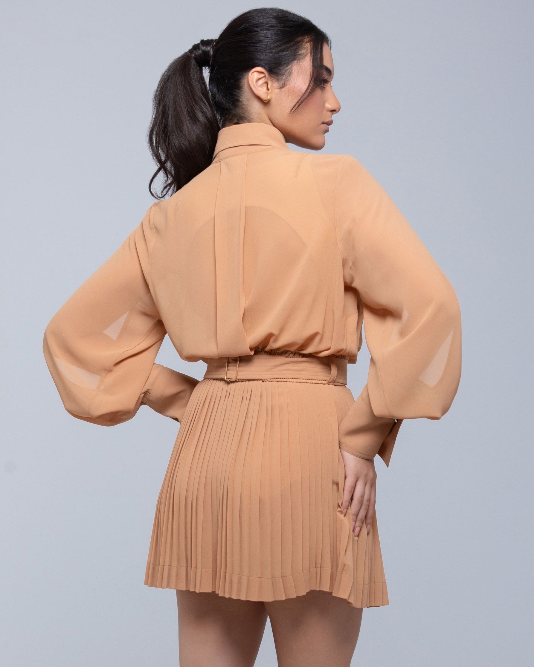 Sheer mini skirt with pleated lightweight fabric and one-side slit
