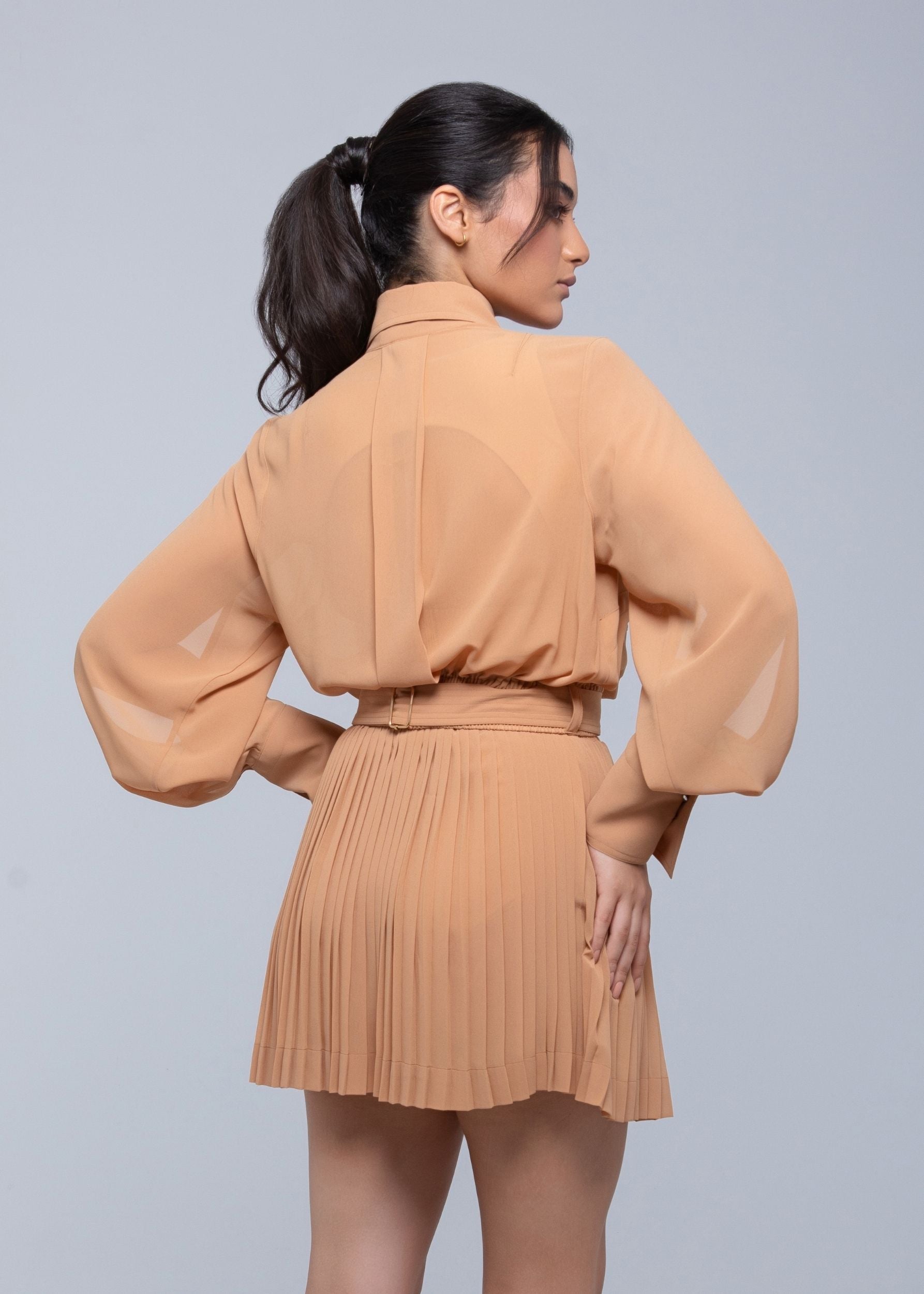 Sheer mini skirt with pleated lightweight fabric and one-side slit