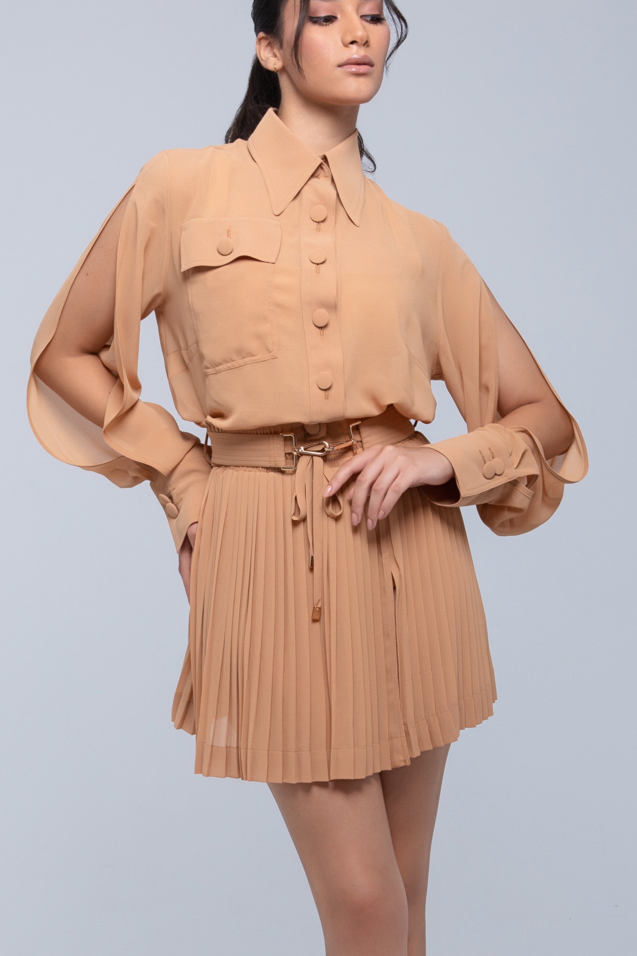 Sheer mini skirt with pleated lightweight fabric and one-side slit