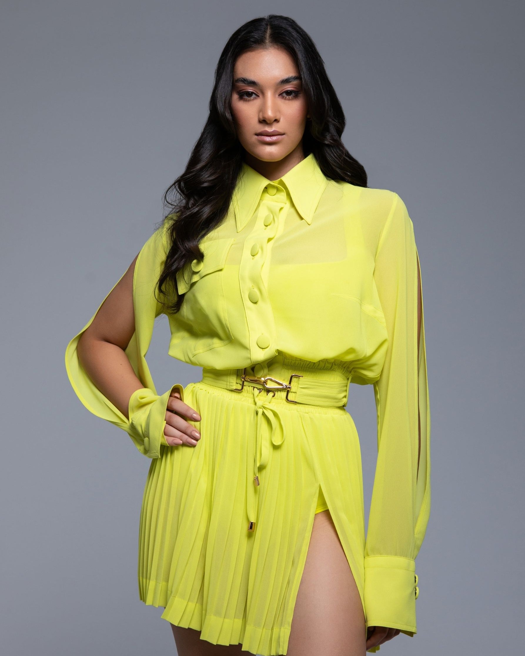 Sheer mini skirt with pleated lightweight fabric and one-side slit