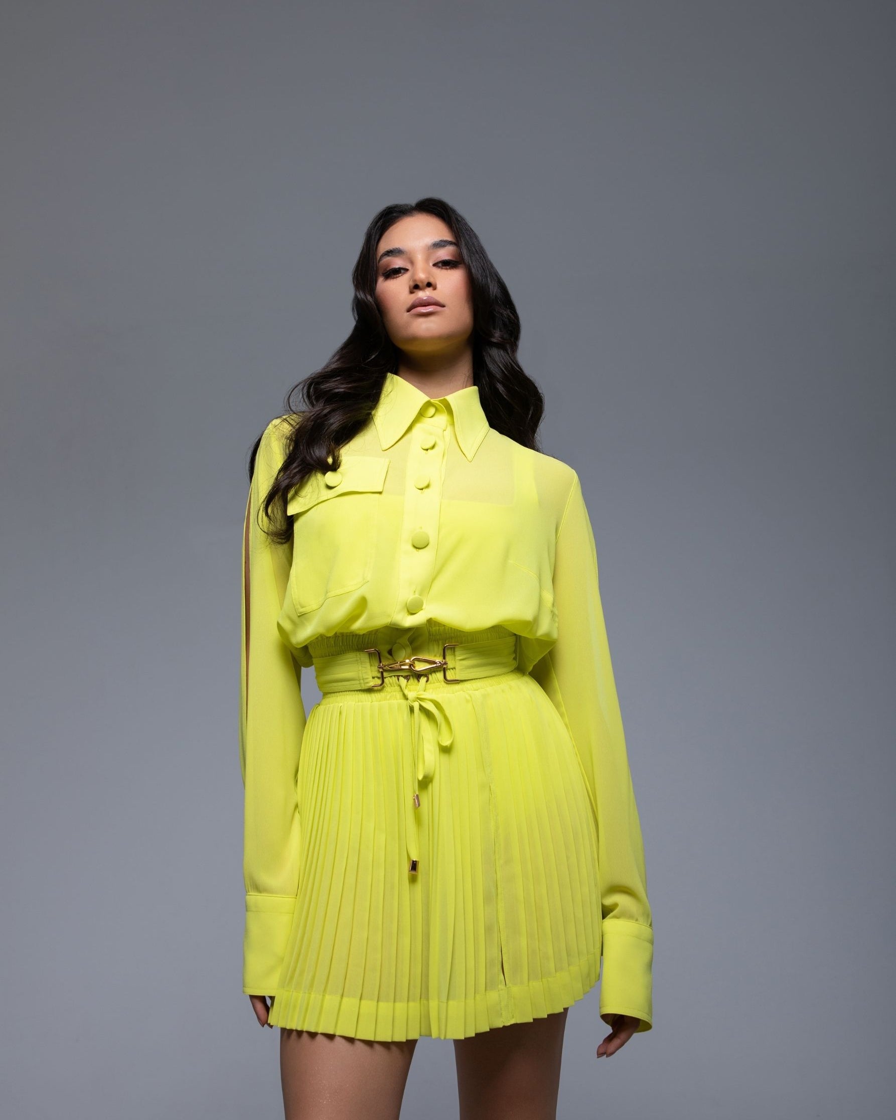 Sheer mini skirt with pleated lightweight fabric and one-side slit