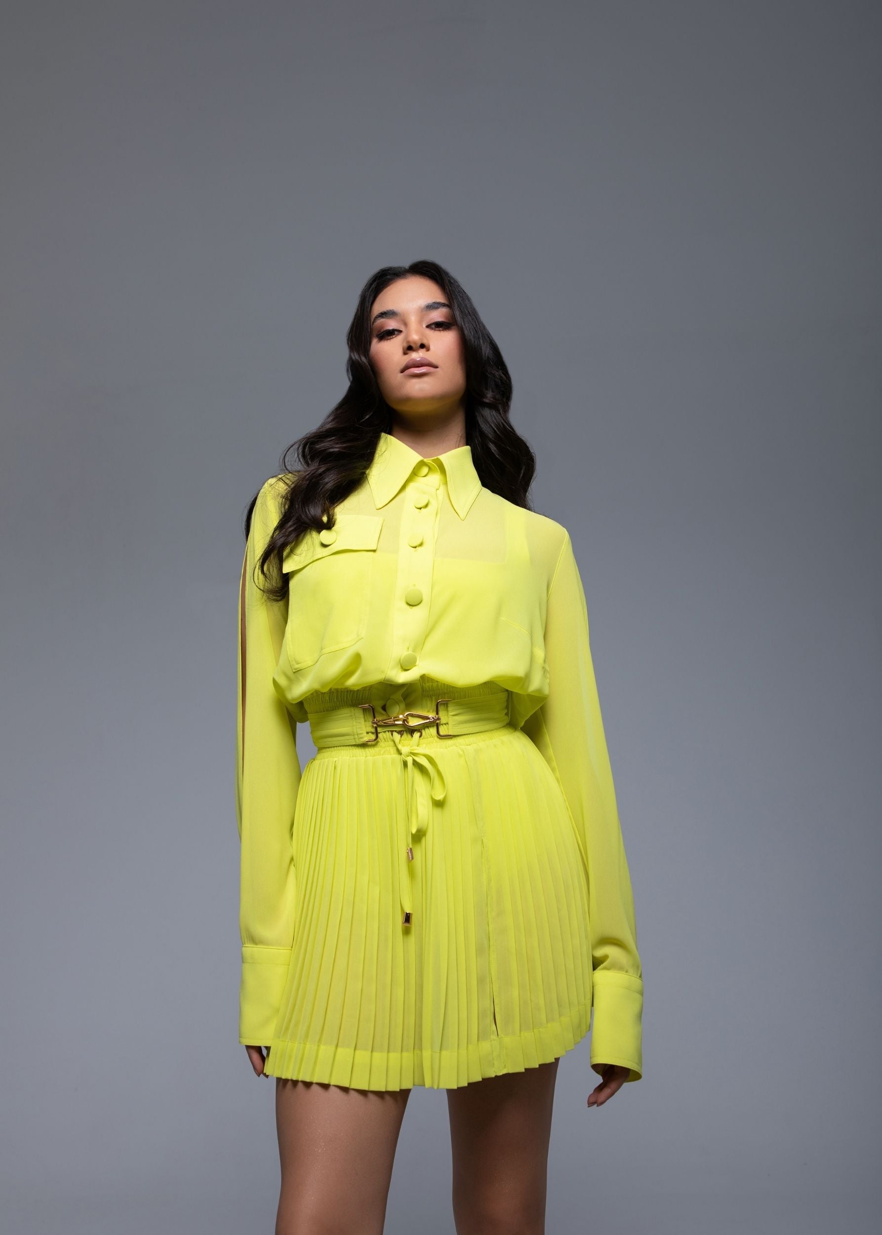 Sheer mini skirt with pleated lightweight fabric and one-side slit