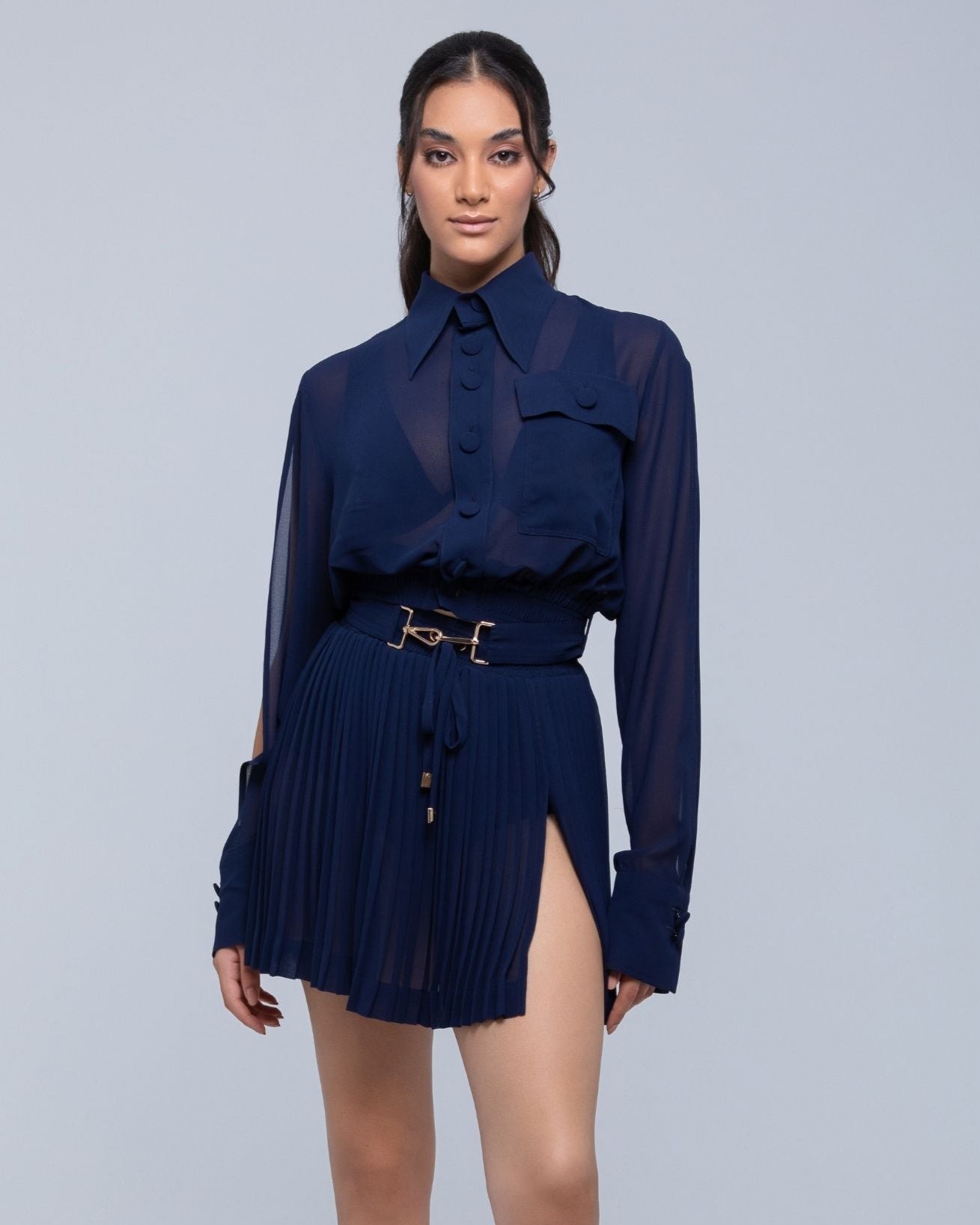 Sheer mini skirt with pleated lightweight fabric and one-side slit