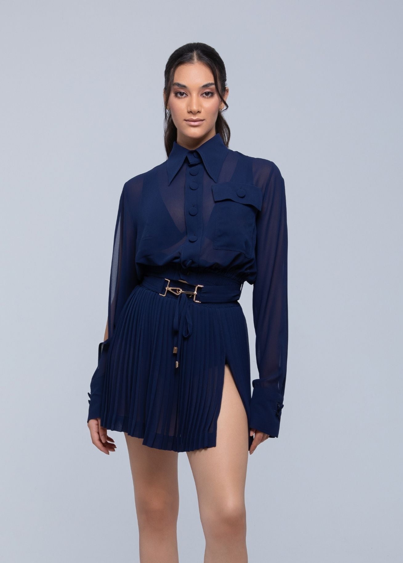 Sheer mini skirt with pleated lightweight fabric and one-side slit