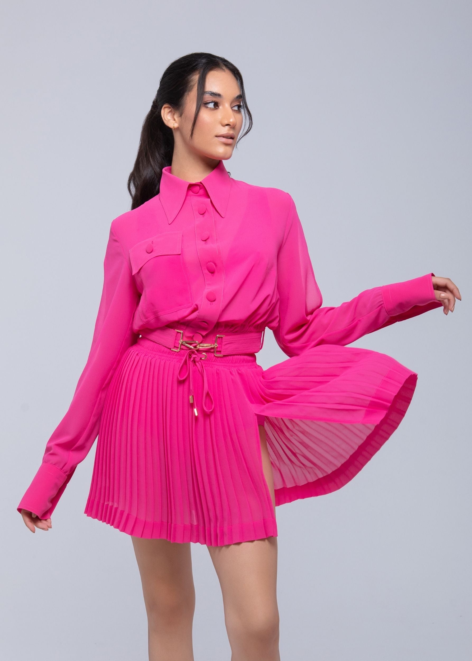 Sheer mini skirt with pleated lightweight fabric and one-side slit