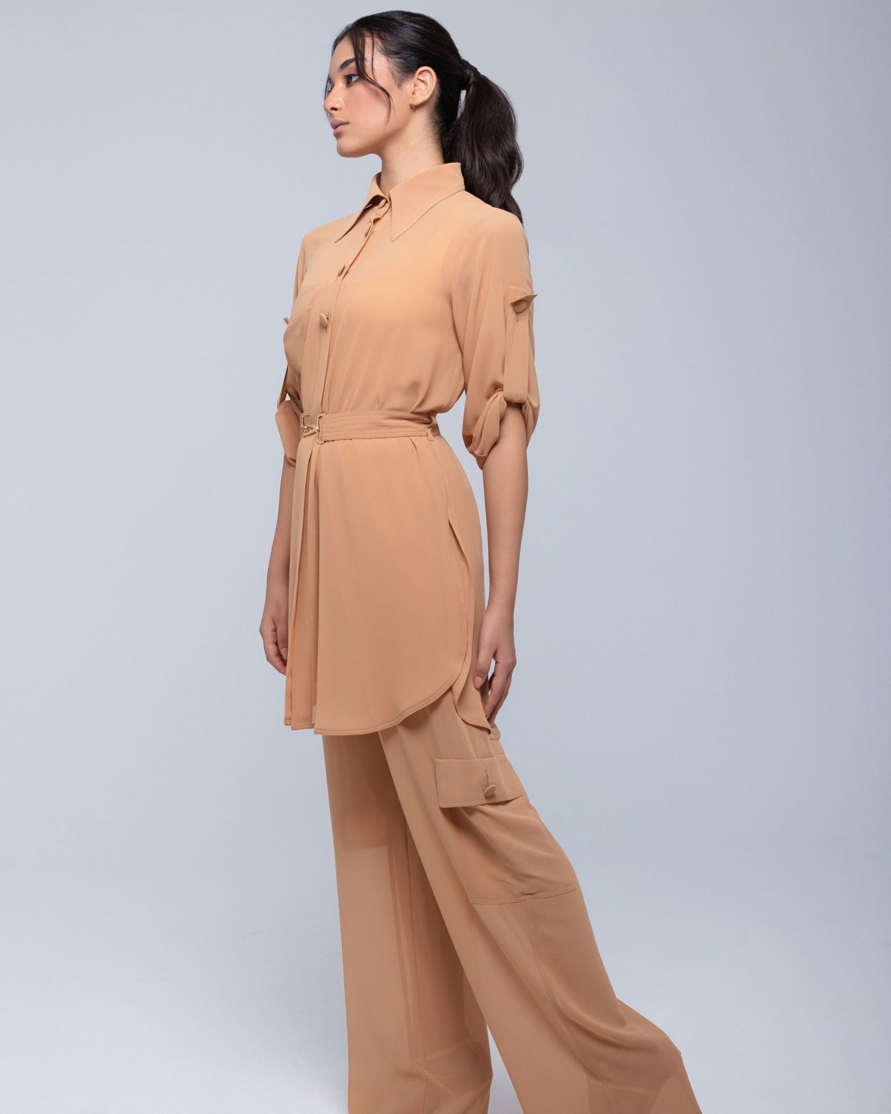 Lightweight sheer pants styled as swimwear cover-up for summer nights