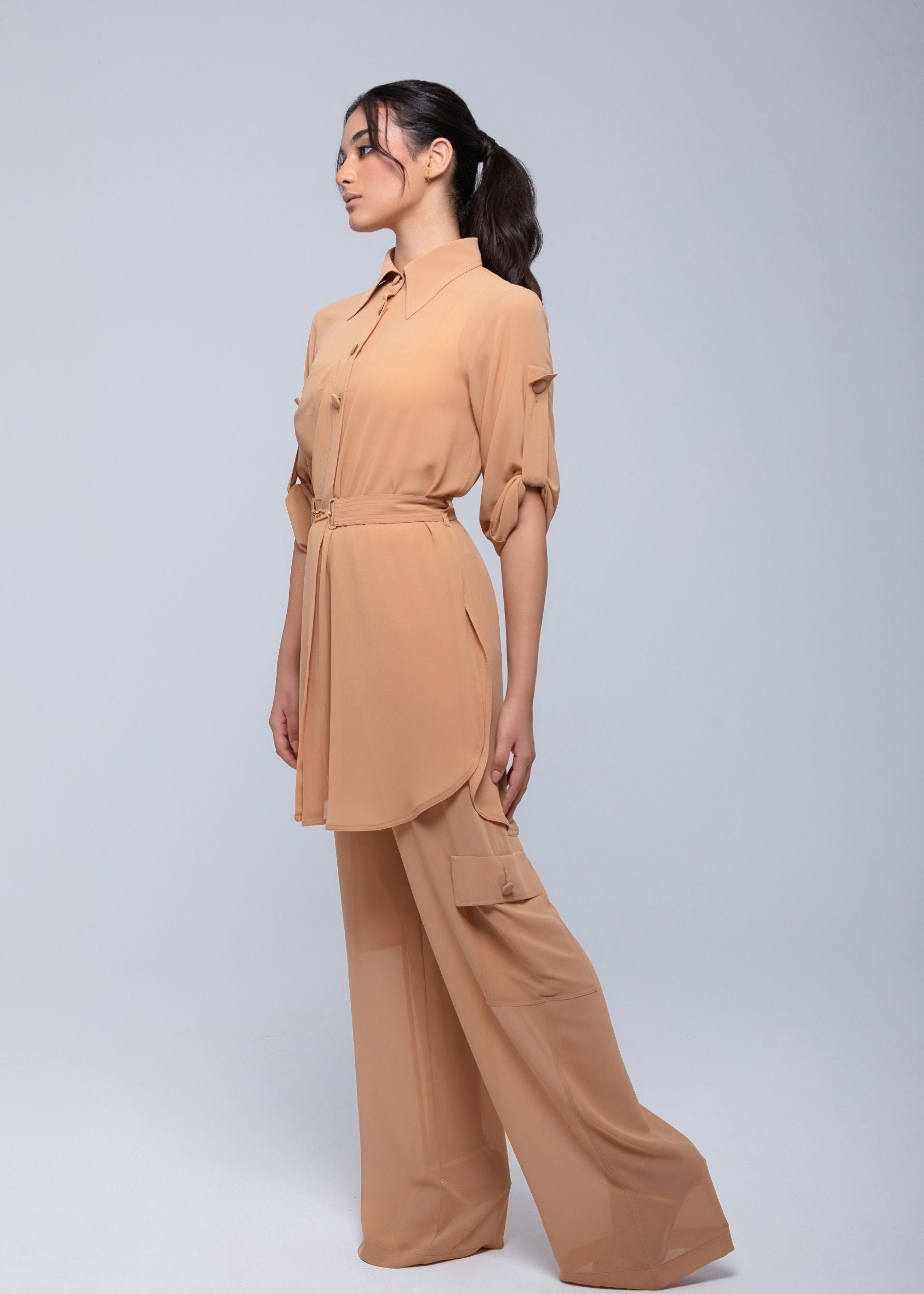 Lightweight sheer pants styled as swimwear cover-up for summer nights