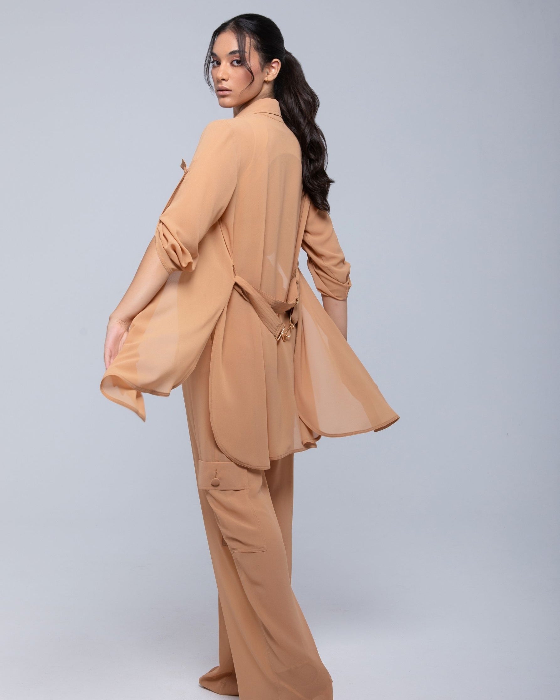 Lightweight sheer pants styled as swimwear cover-up for summer nights