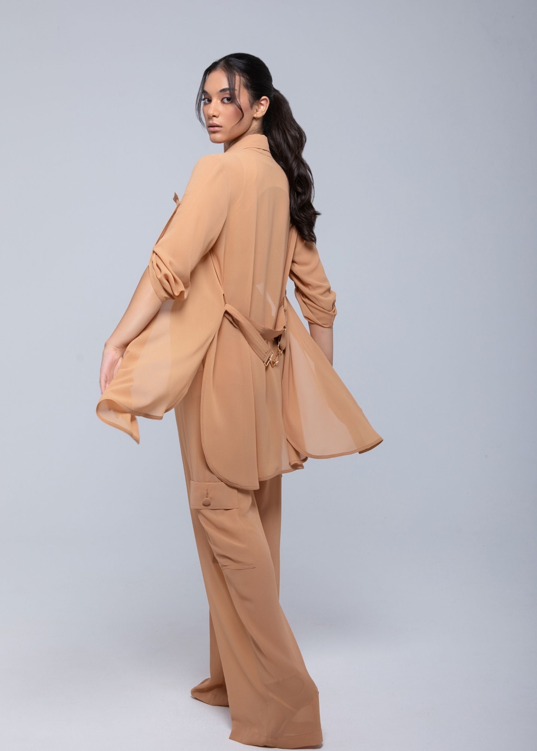 Lightweight sheer pants styled as swimwear cover-up for summer nights