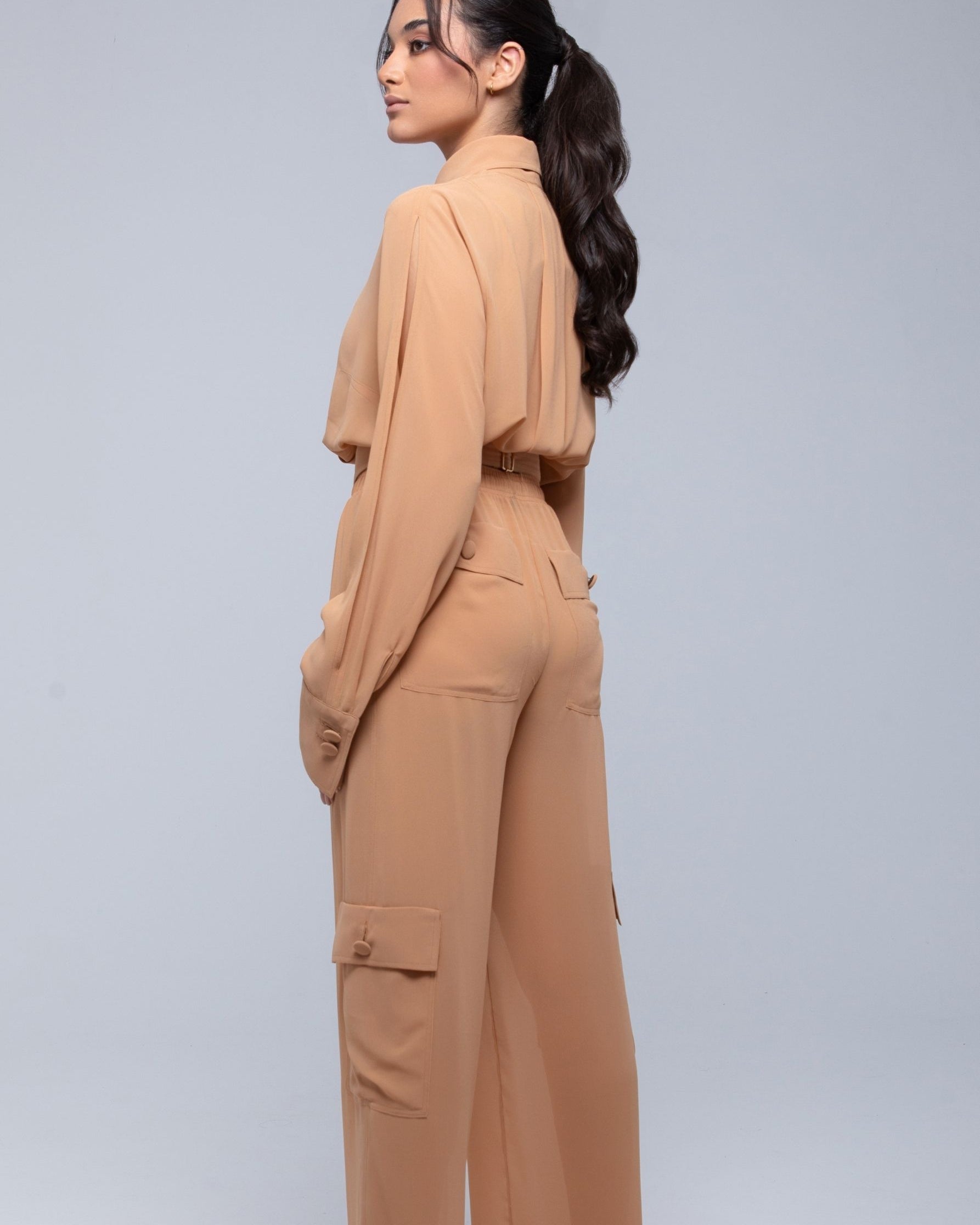 Lightweight sheer pants styled as swimwear cover-up for summer nights