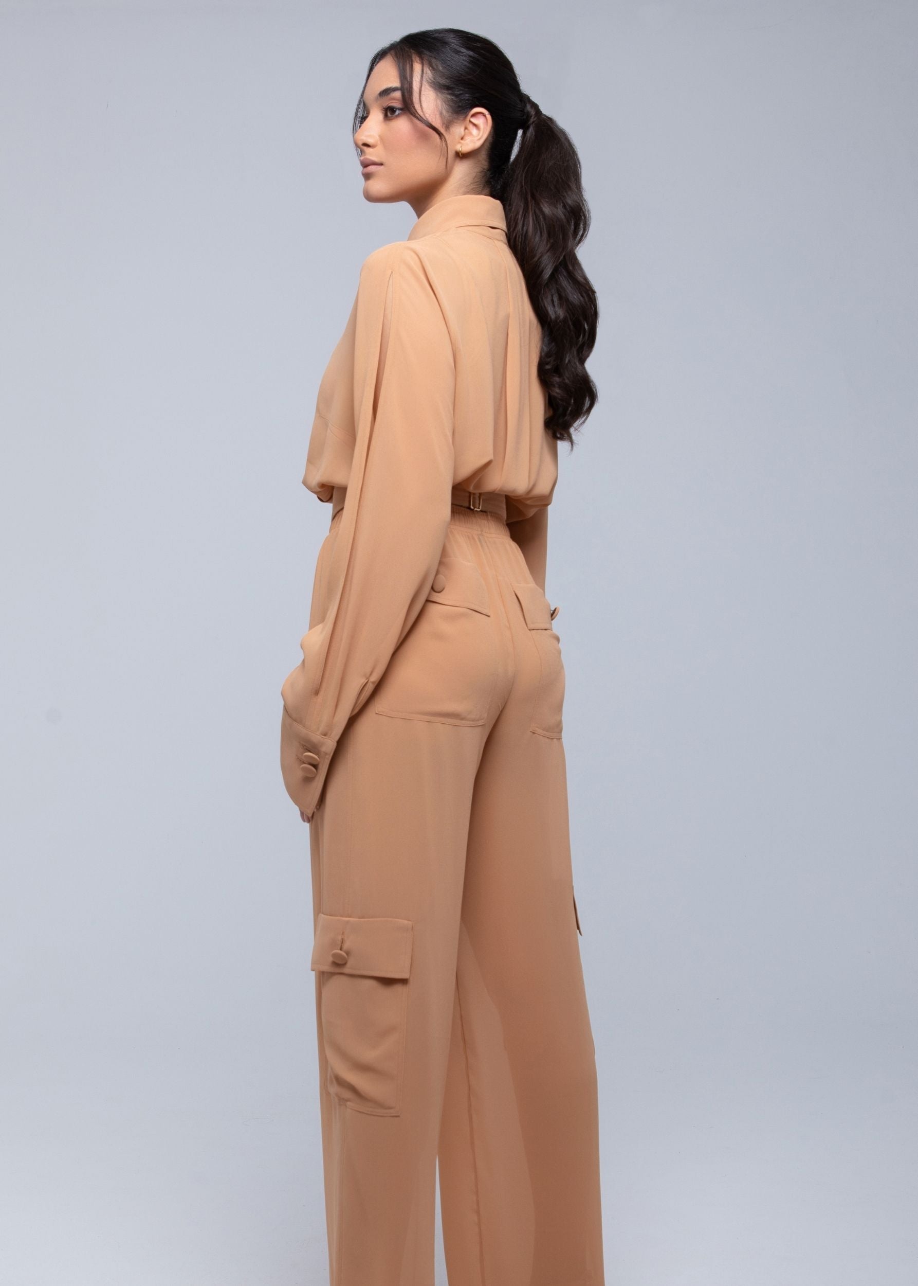 Lightweight sheer pants styled as swimwear cover-up for summer nights