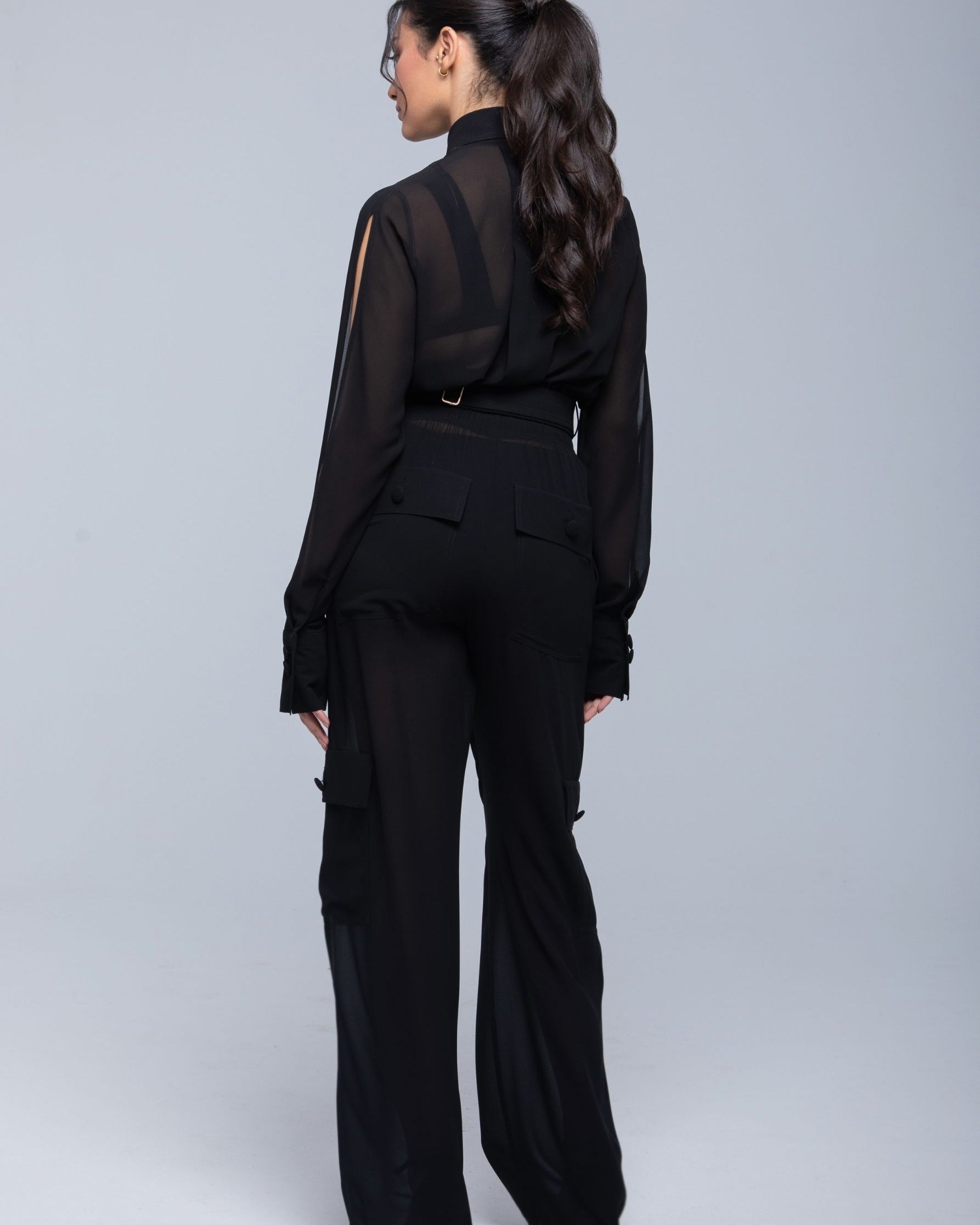 Lightweight sheer pants styled as swimwear cover-up for summer nights