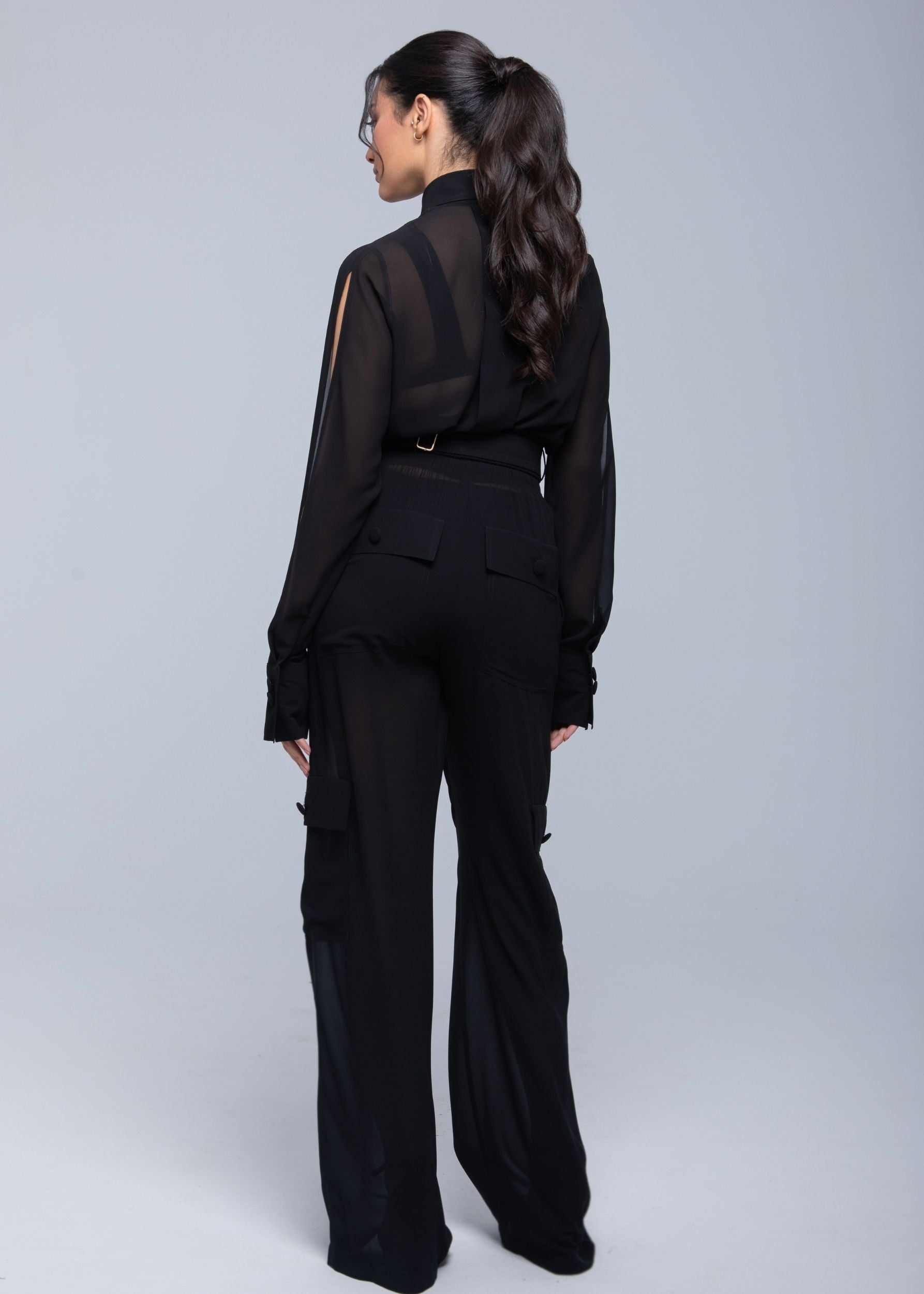 Lightweight sheer pants styled as swimwear cover-up for summer nights