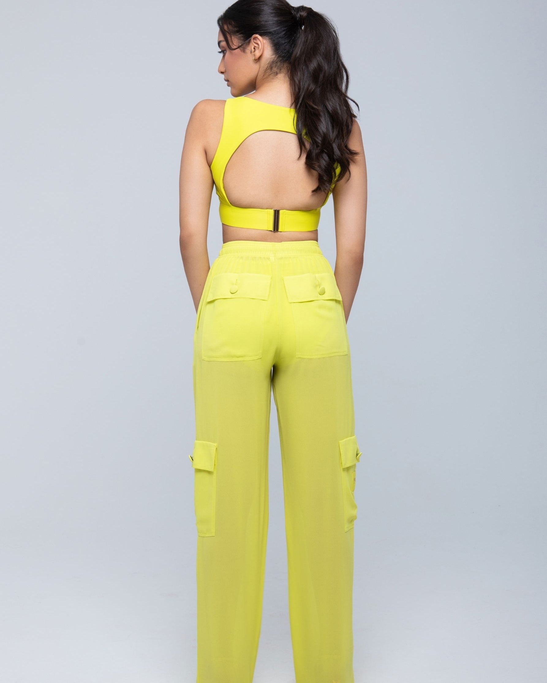 Lightweight sheer pants styled as swimwear cover-up for summer nights