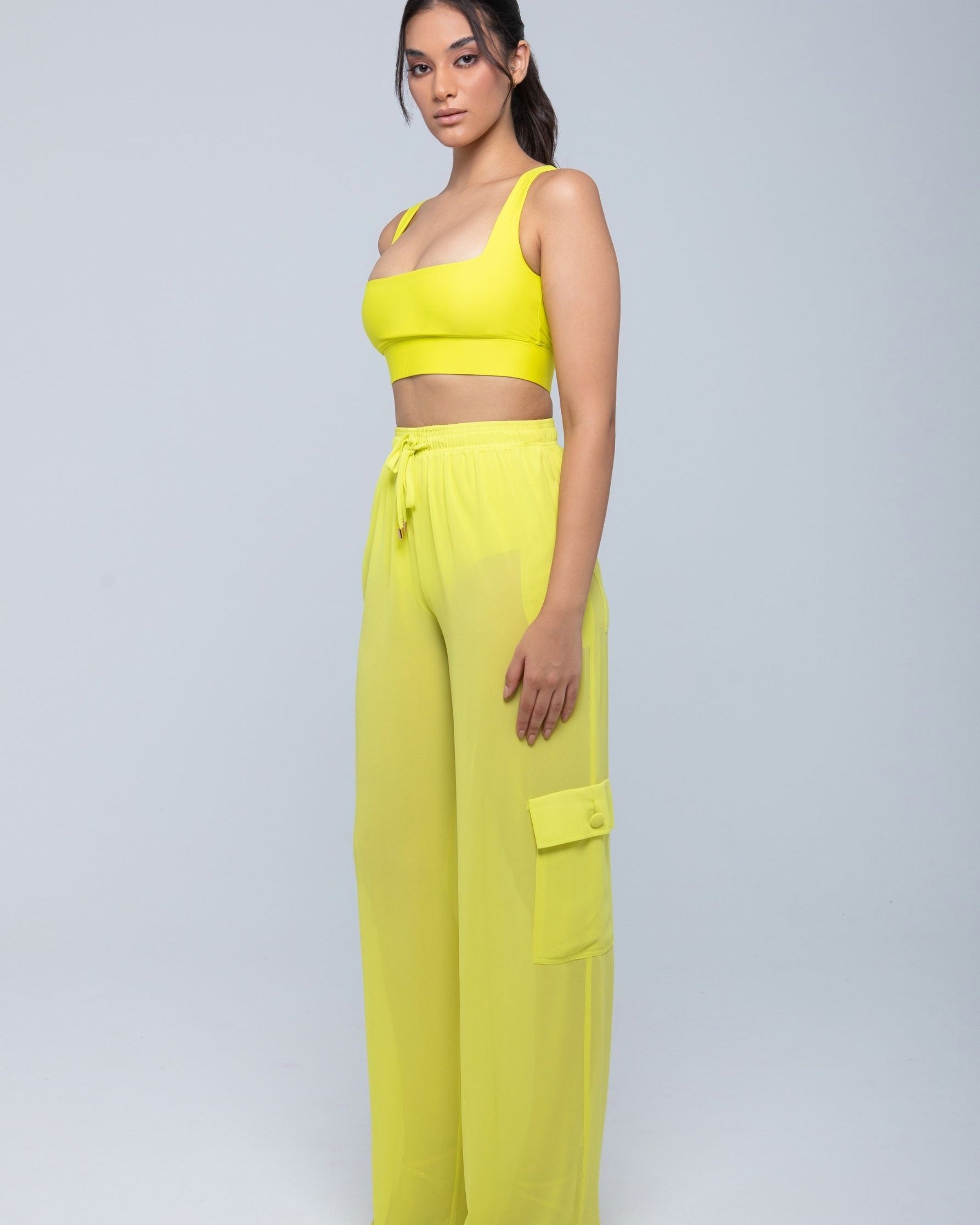 Lightweight sheer pants styled as swimwear cover-up for summer nights