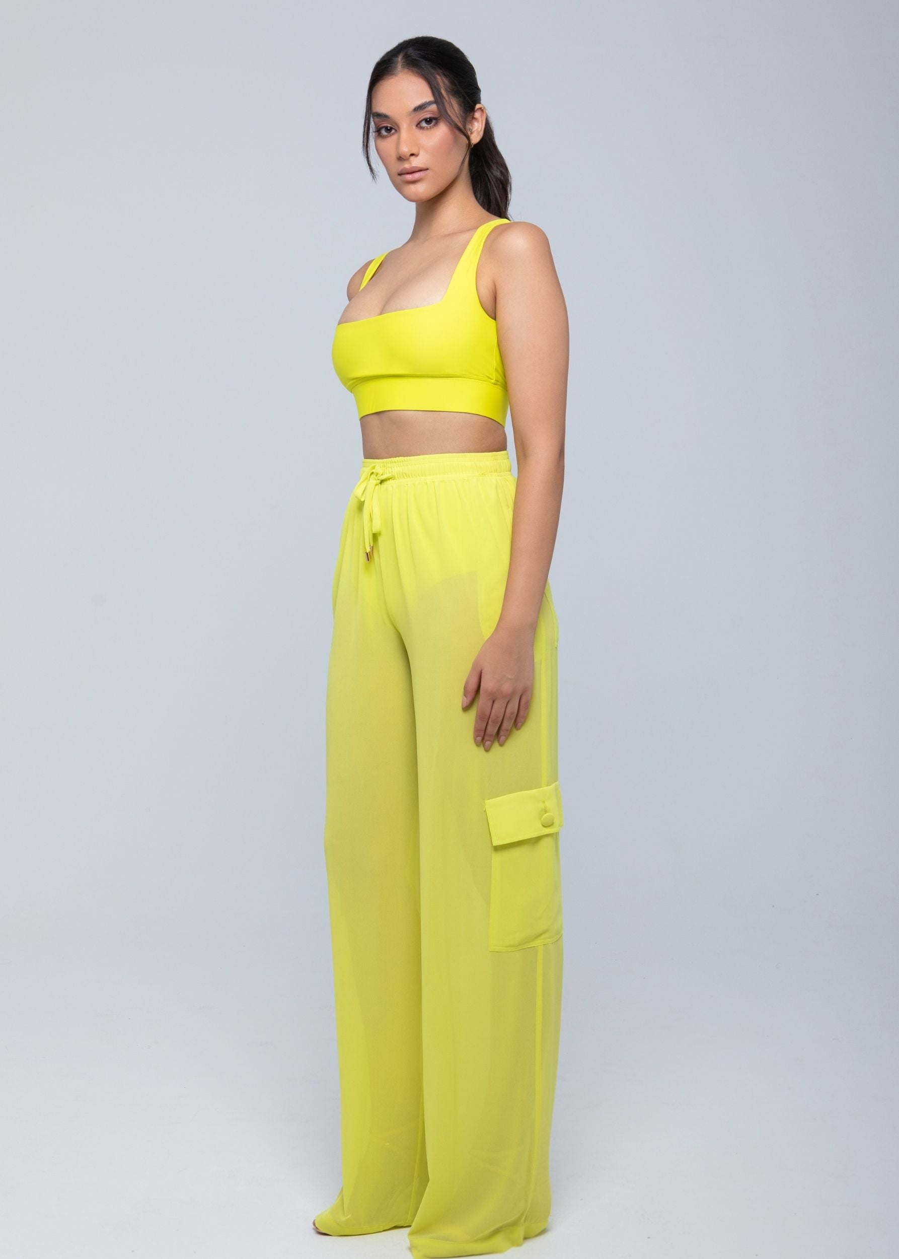 Lightweight sheer pants styled as swimwear cover-up for summer nights