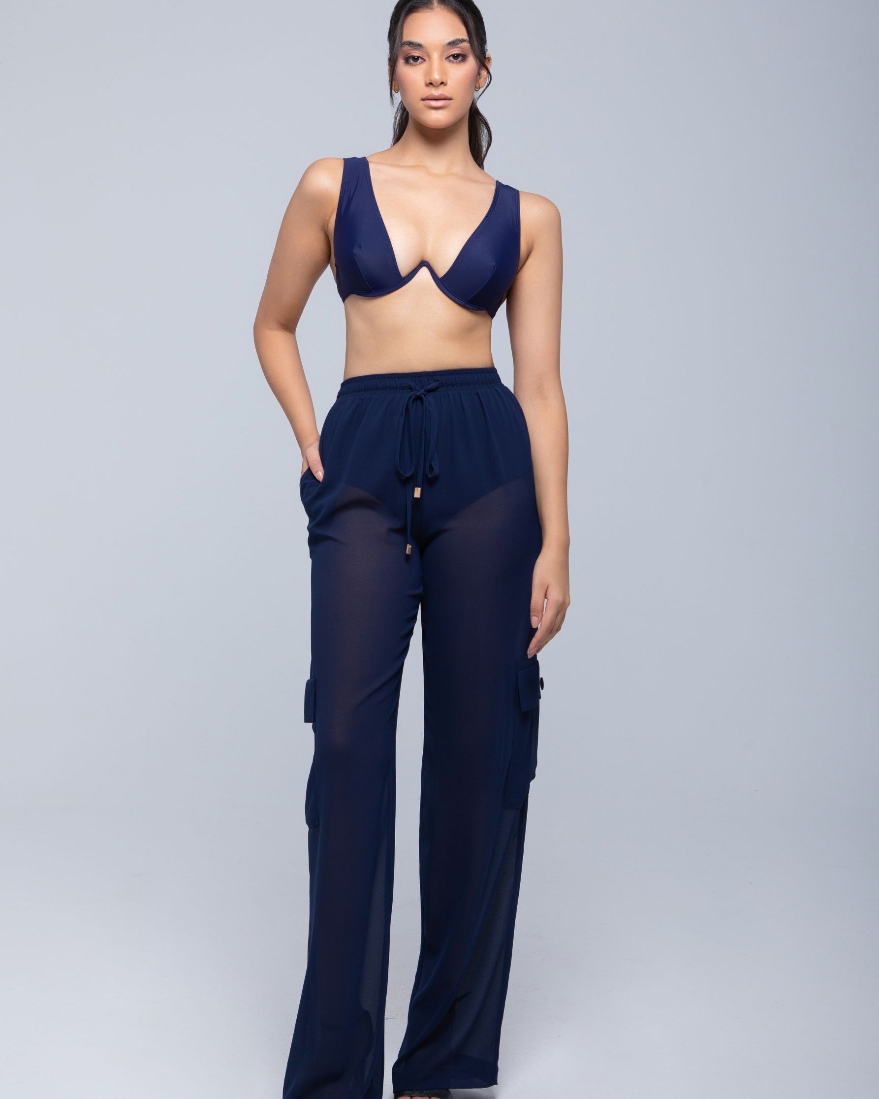 Lightweight sheer pants styled as swimwear cover-up for summer nights