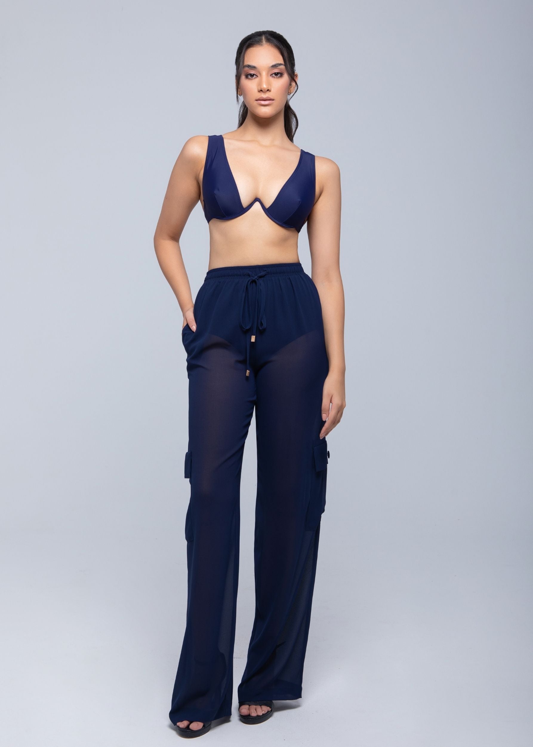 Lightweight sheer pants styled as swimwear cover-up for summer nights