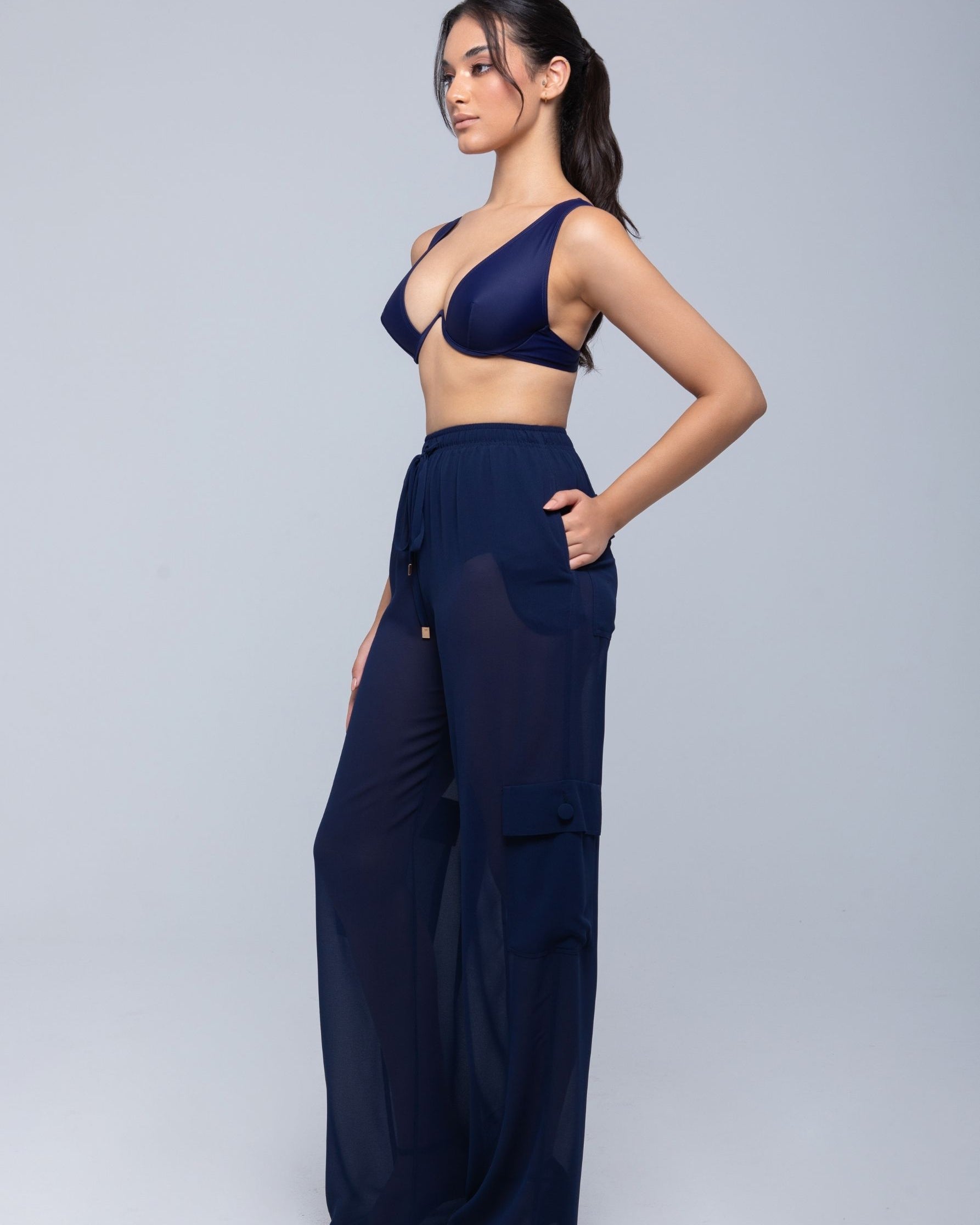 Lightweight sheer pants styled as swimwear cover-up for summer nights