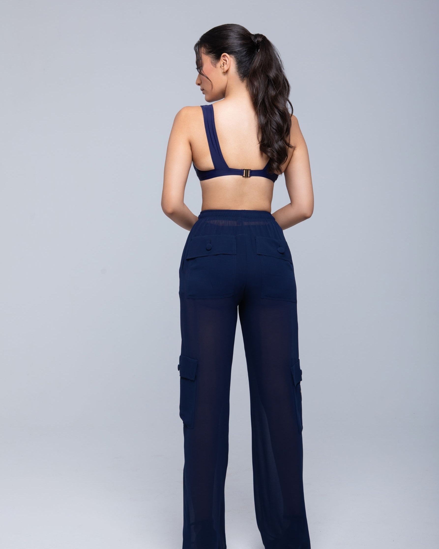 Lightweight sheer pants styled as swimwear cover-up for summer nights