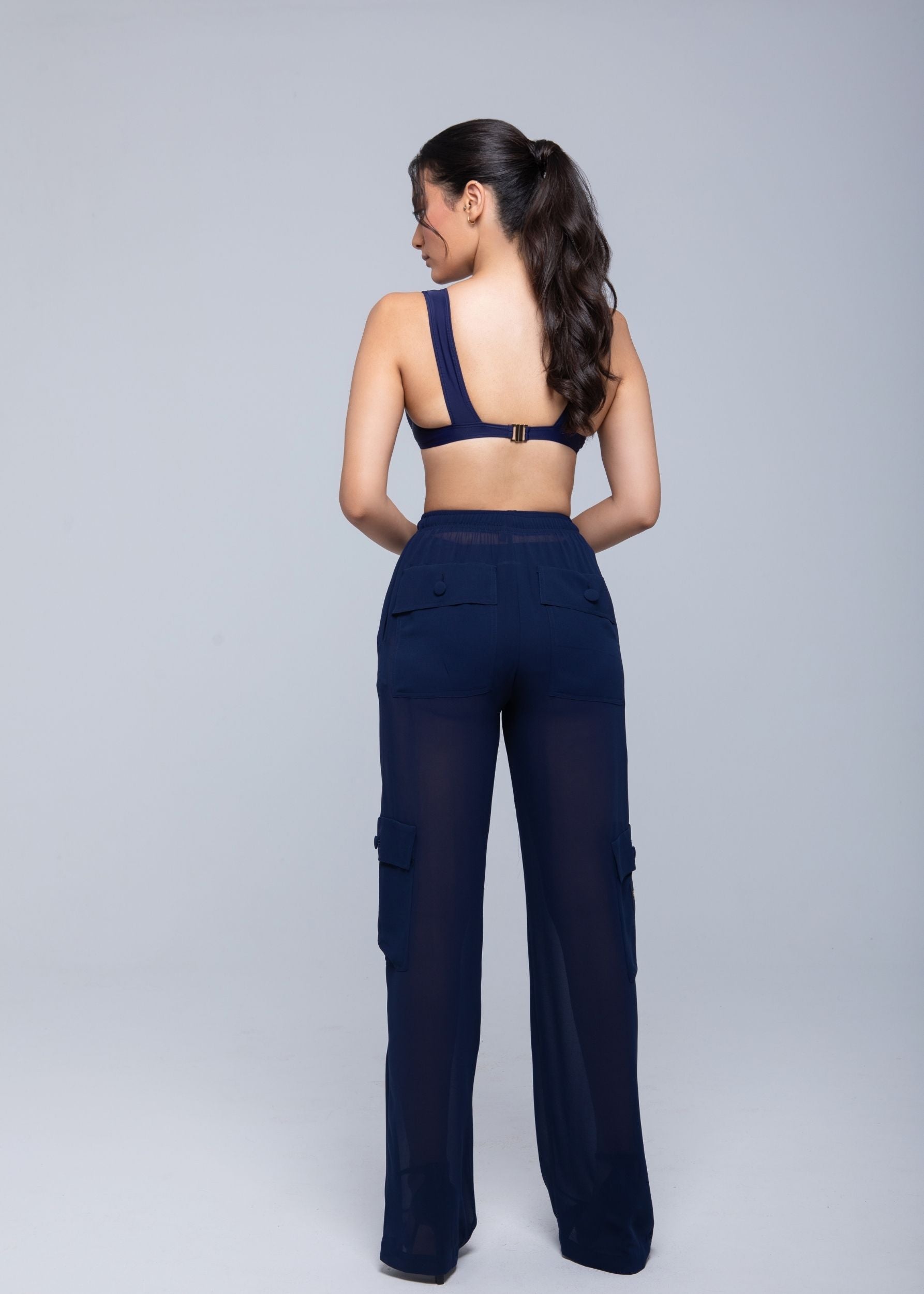 Lightweight sheer pants styled as swimwear cover-up for summer nights