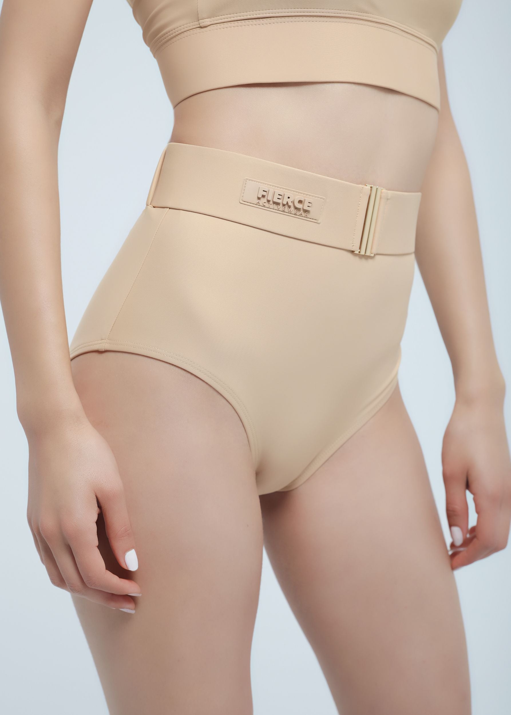 Beige shapewear with a Fierce brand logo on a light gray background