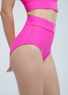 Bright Fierce pink high-waisted bikini bottom on a white background