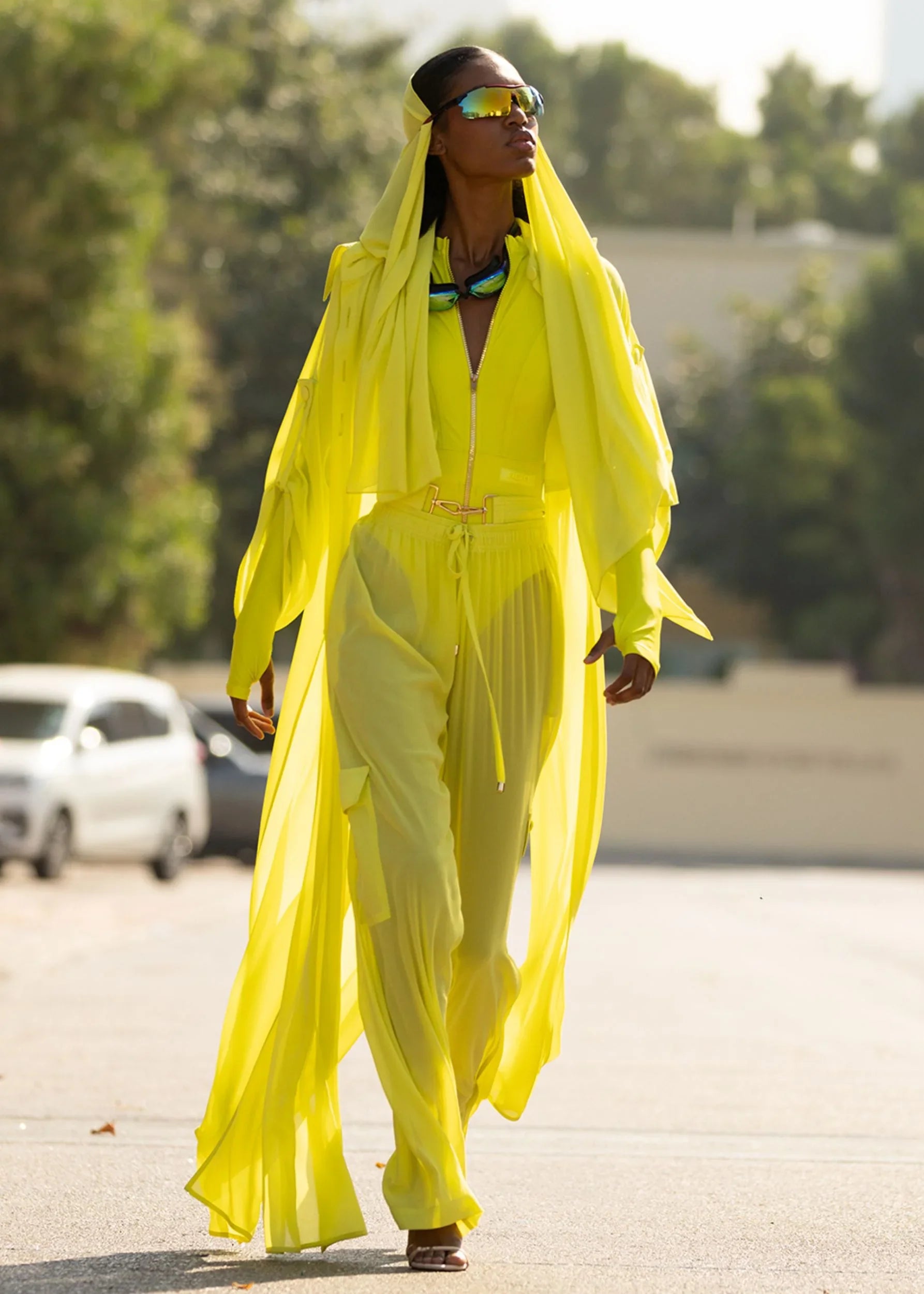  Lightweight sheer pants styled as swimwear cover-up for summer nights