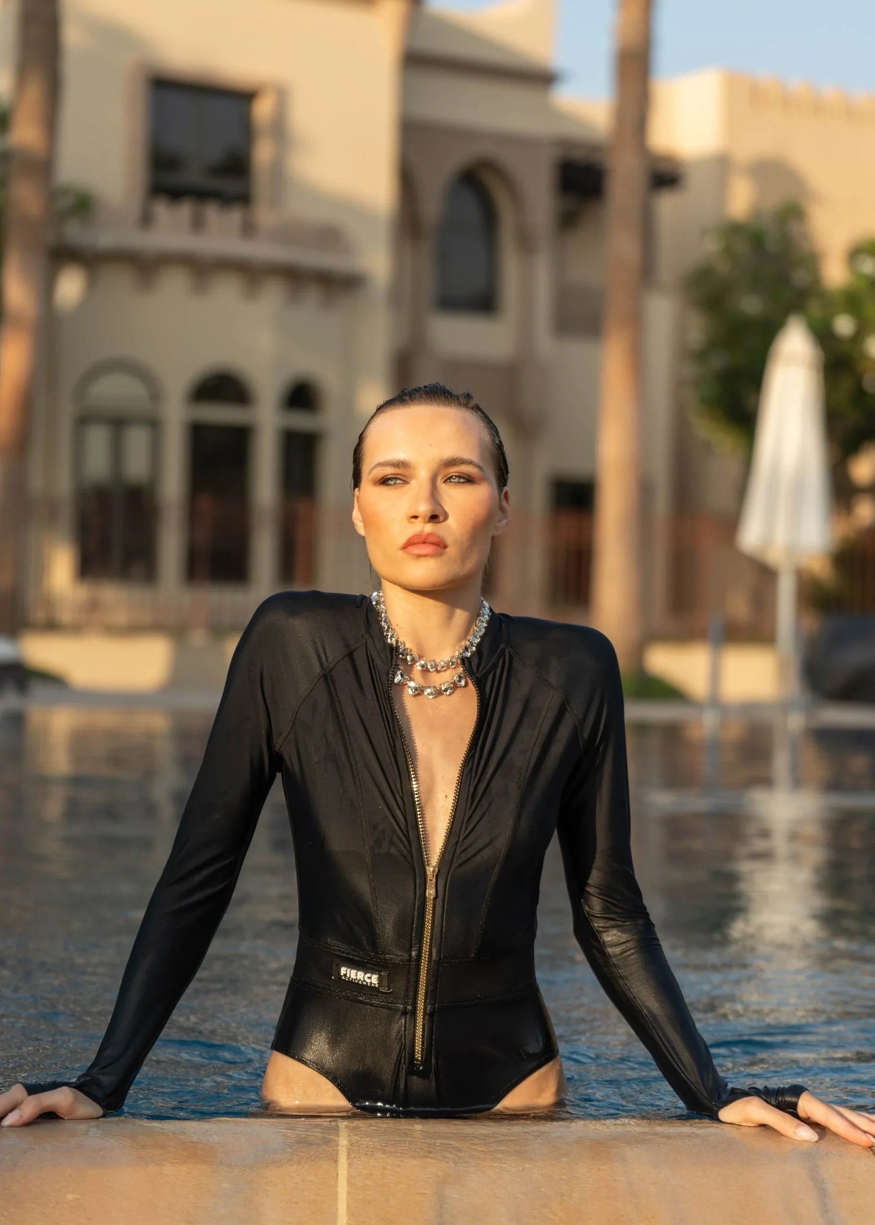 UV-protected one-piece swimwear with thumb holes and sleek design