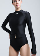 Black Fierce swimsuit with long sleeves and a gold belt on a white background