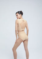 Backless bikini top designed for swim, sport, and night-out versatility