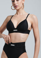Front view of a woman wearing the Fierce Activewear Serena triangle bikini top with matching high-waisted X-Shape bottom in black, featuring logo detailing and a supportive fit
