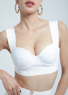 This image features the stylish and chic Fierce FAYA Bikini Top, which is showcased on a model. The bikini top is black, with a classic and elegant design that includes a cleavage enhancing shape and sleek, adjustable straps.