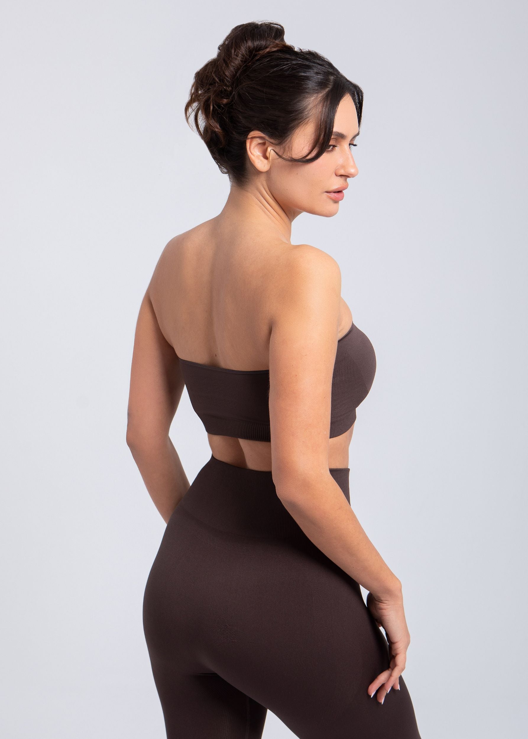 Model standing in Espresso sculpt push-up bandeau bra three-quarter front view