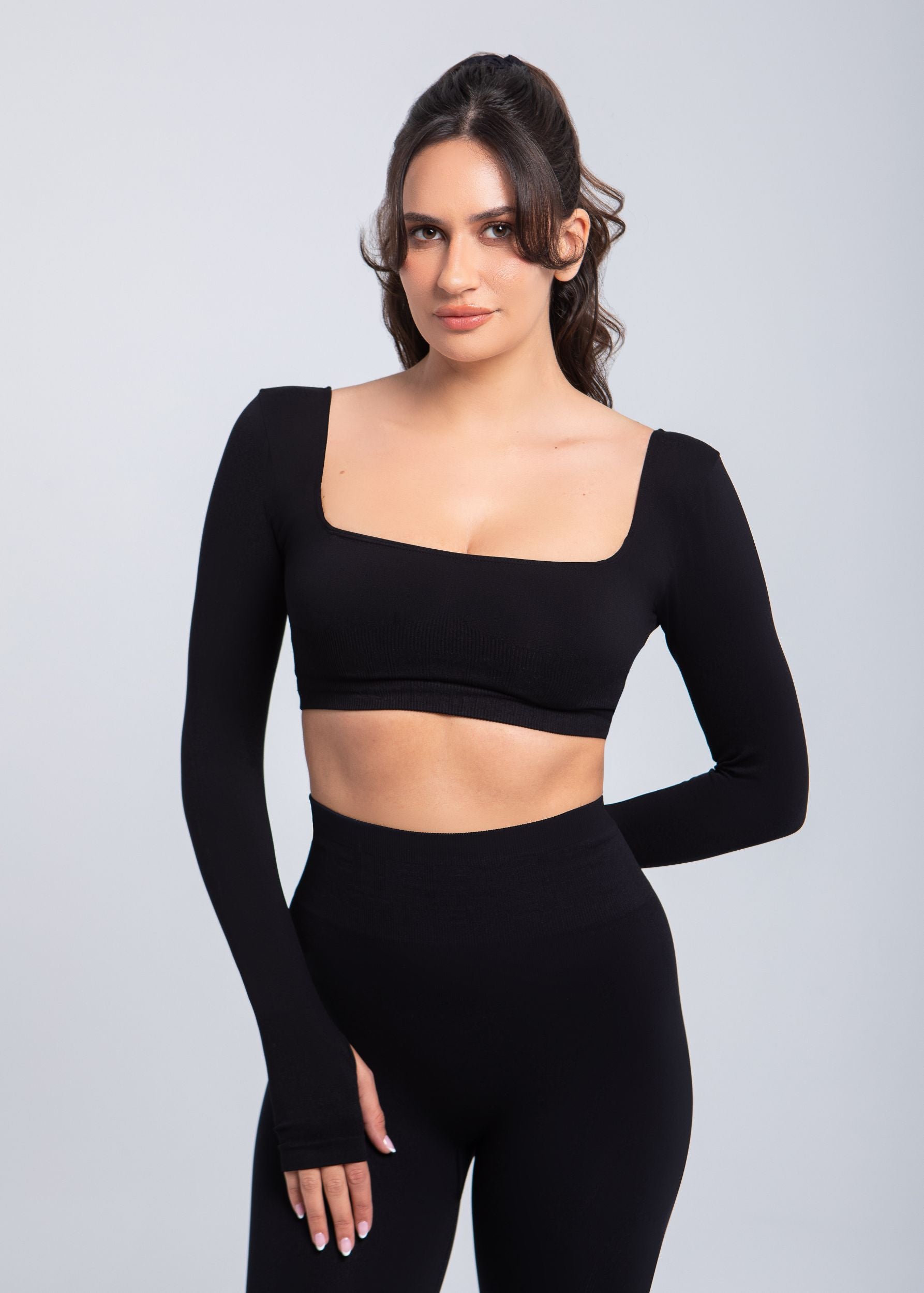 Front portrait of Second Skin sculpt push-up long sleeve bra in Black emphasizing neckline and support structure